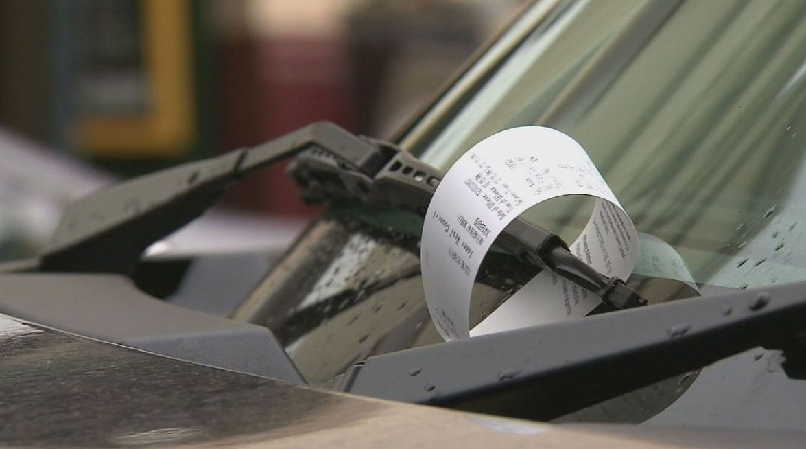 Paper parking ticket issued to a driver