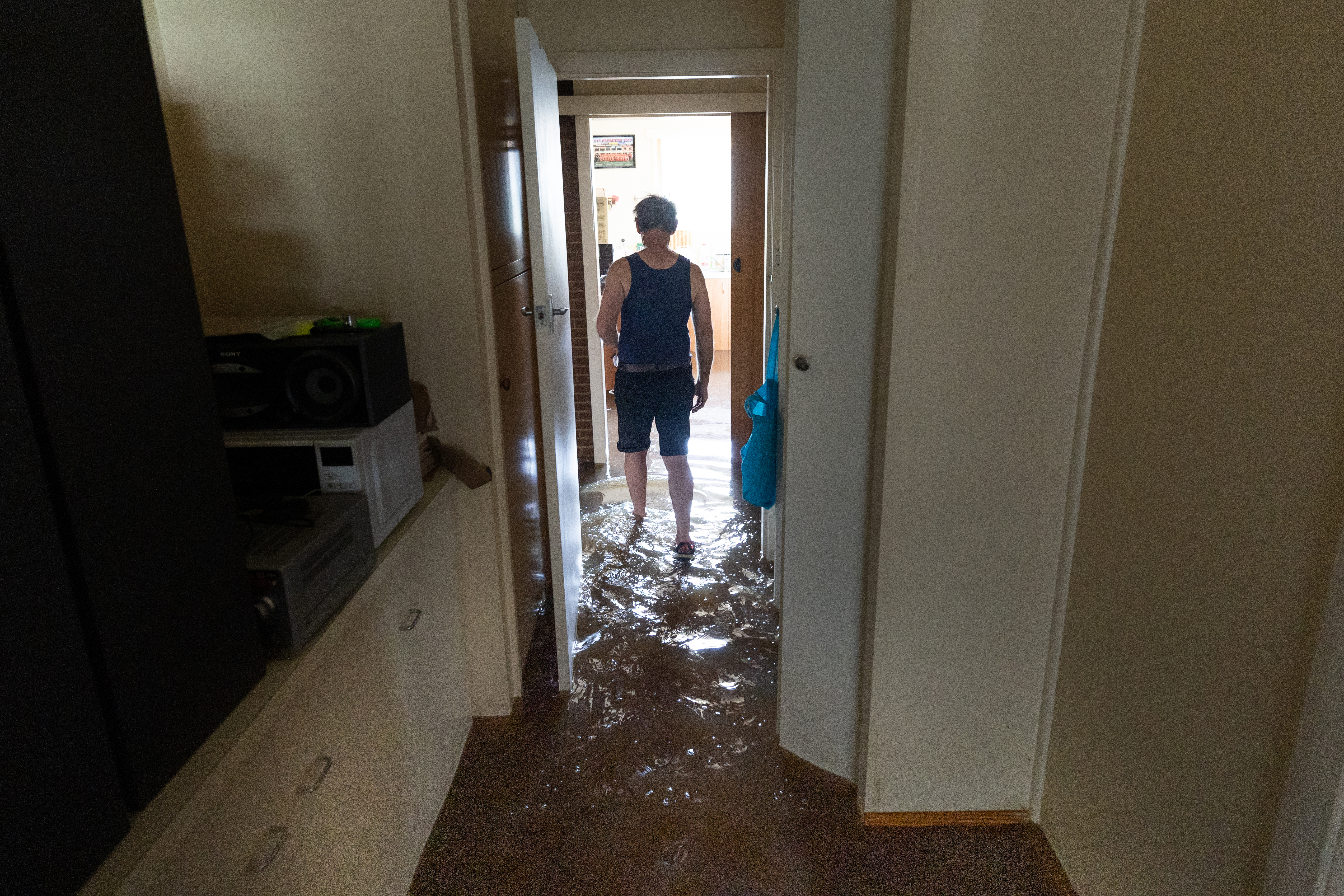 Shepparton  local "John" walk through his flooded home.