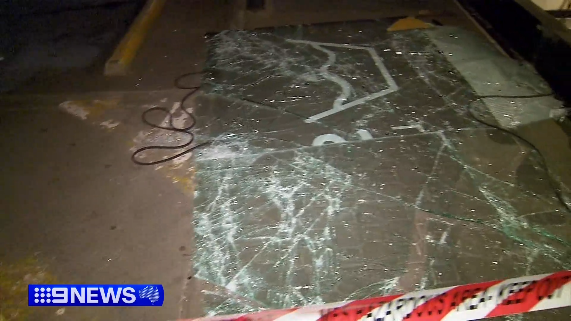 Smashed glass was seen on the ground near the laundromat.