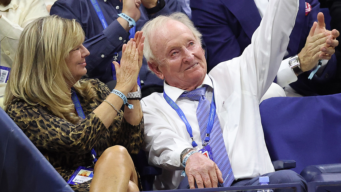Rod Laver, former tennis player, waves as he attends the Men's Singles semifinal match between Novak Djokovic of Serbia and Alexander Zverev 