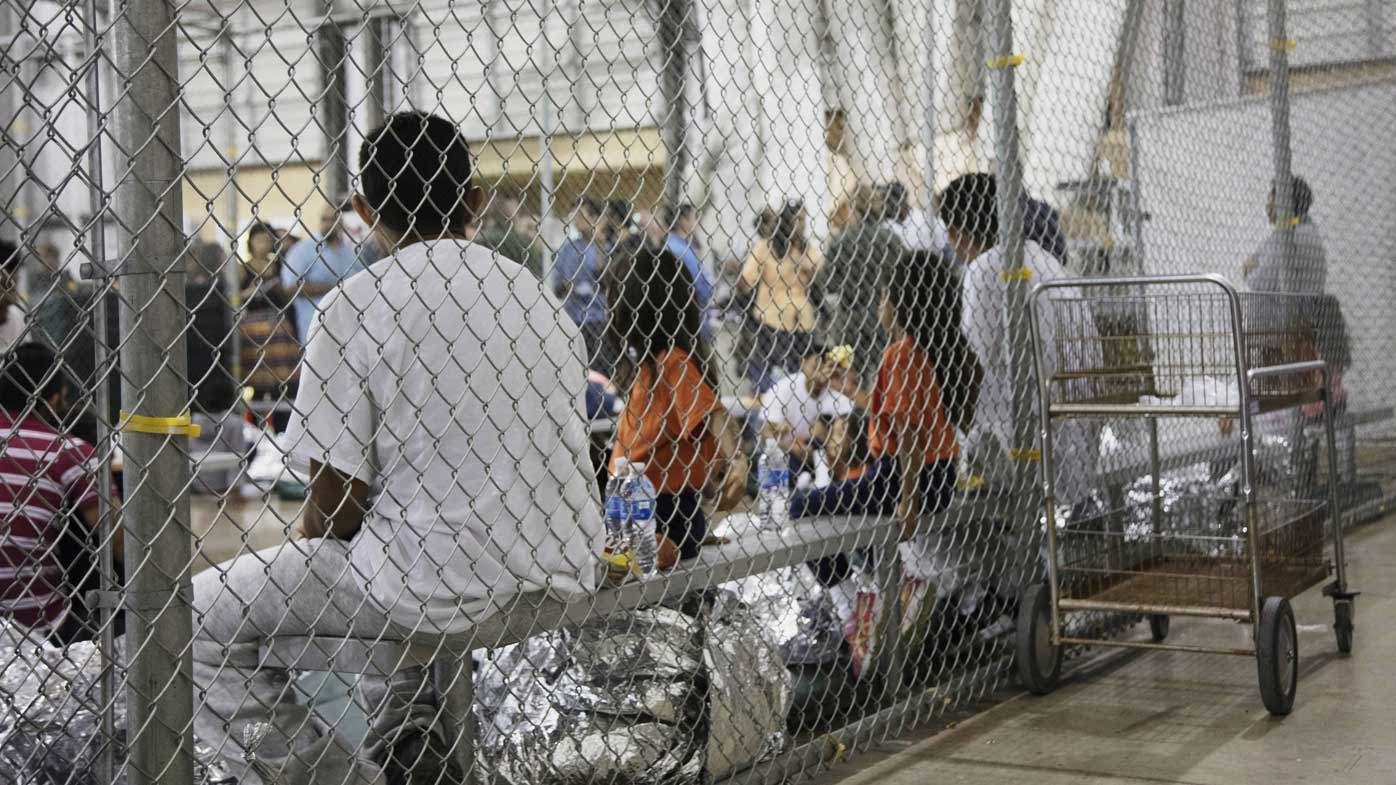 Migrants are locked in cages at a detention facility in McAllen, Texas.