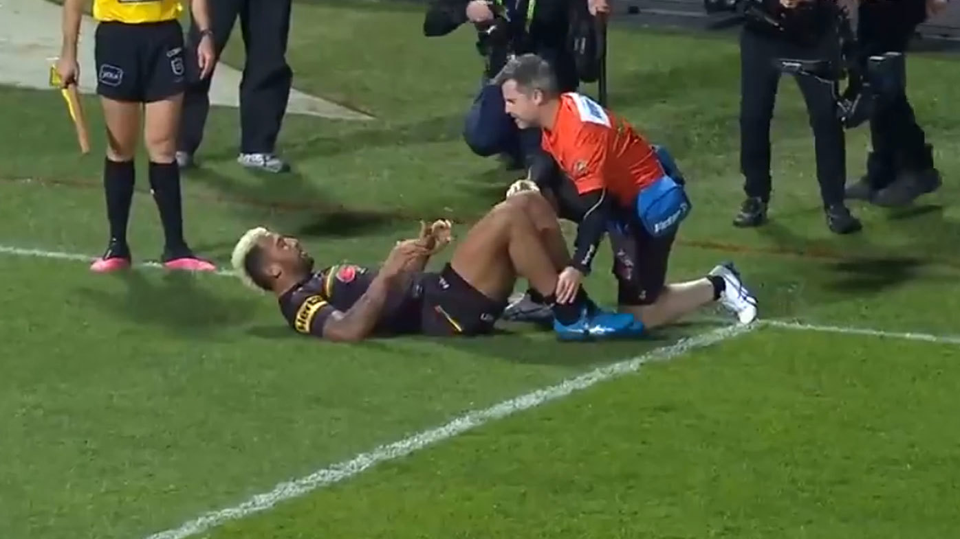 Viliame Kikau is attended to by a club trainer 