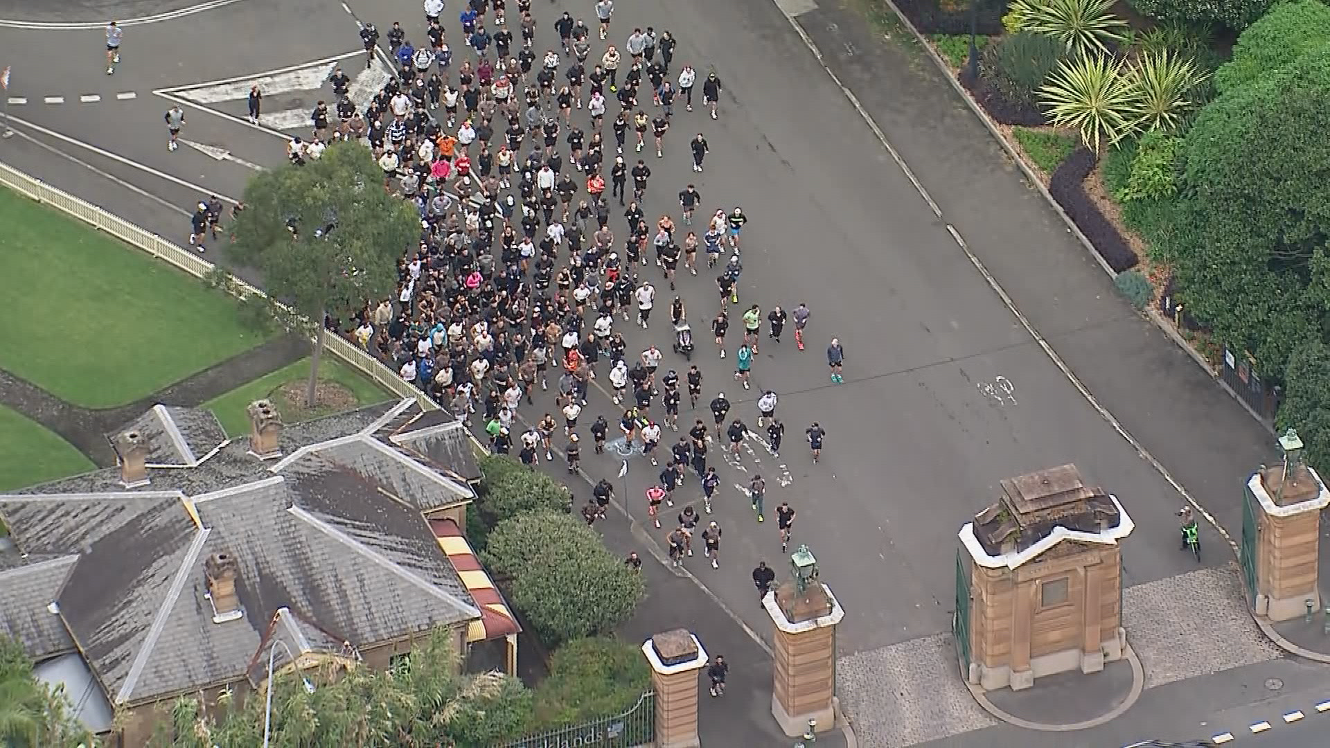 Goodge and his followers depart Centennial Park.