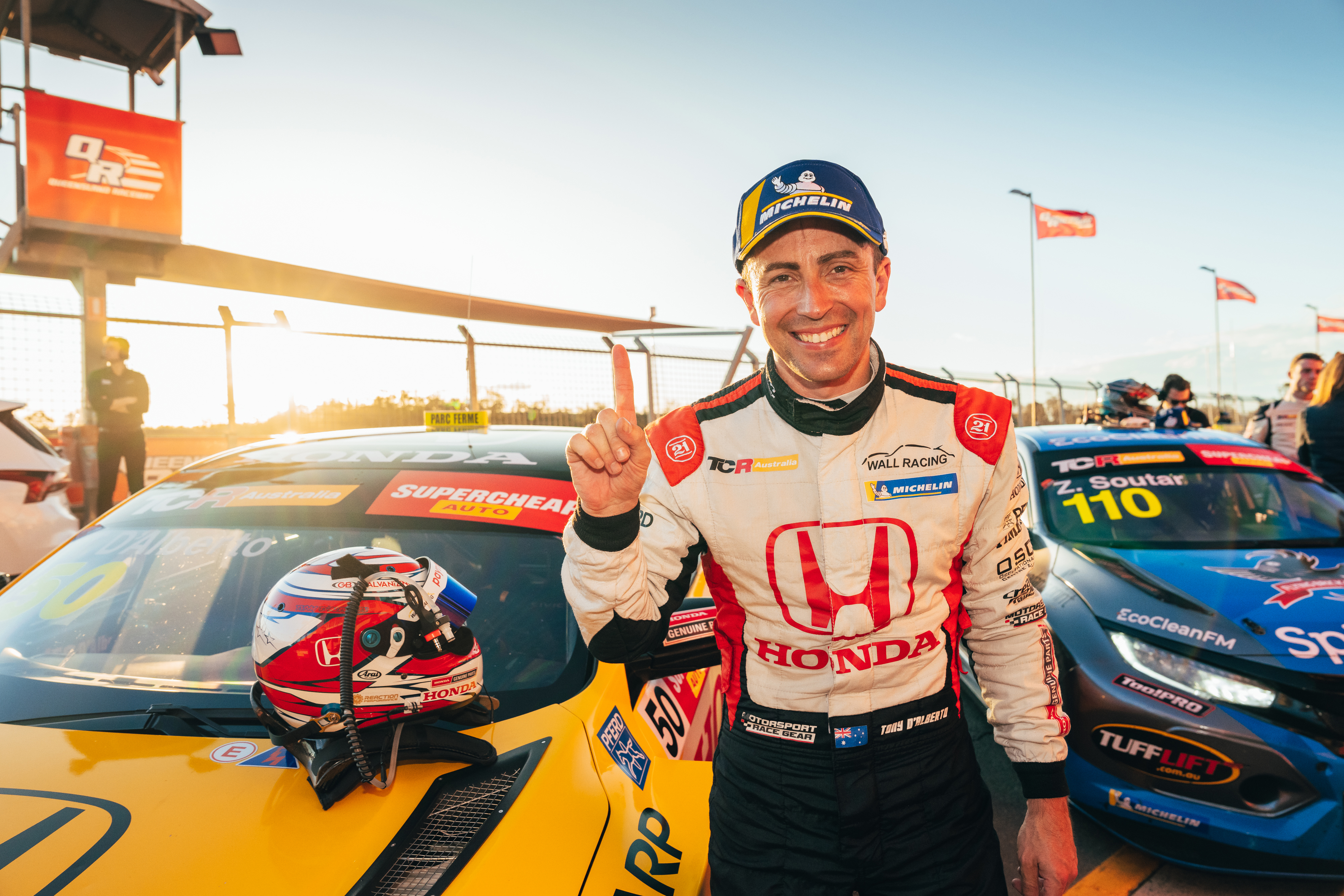 Wall Racing's Tony D'Alberto celebrates victory at Queensland Raceway.