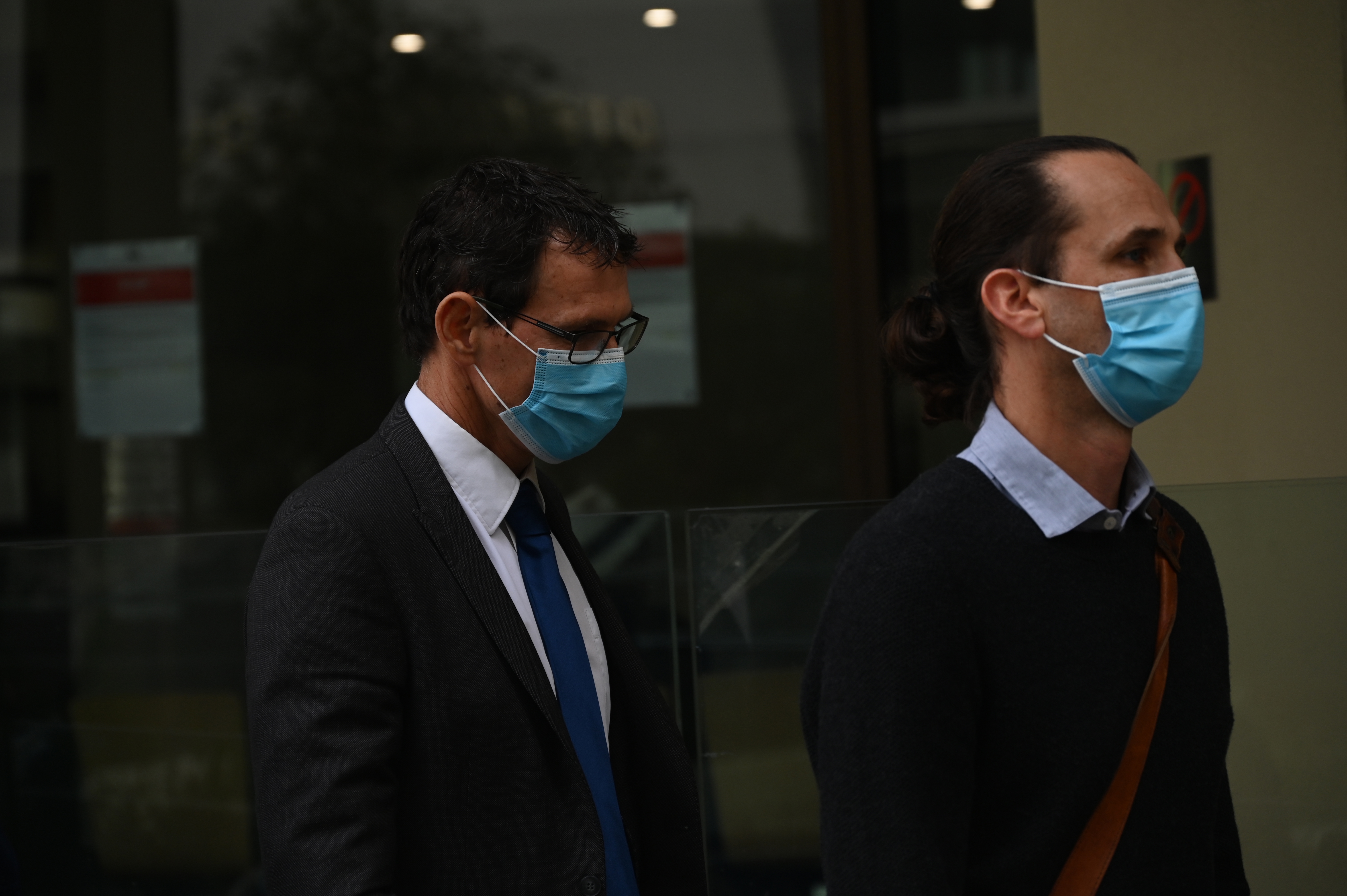 Dr William Hollaway(left) leaves the coronial inquest into Aishwarya Aswath.