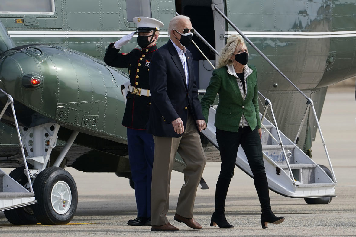 President Joe Biden and first lady Jill Biden walk from Marine One towards Air Force One at Andrews Air Force Base, Md., Friday, Feb. 26, 2021.