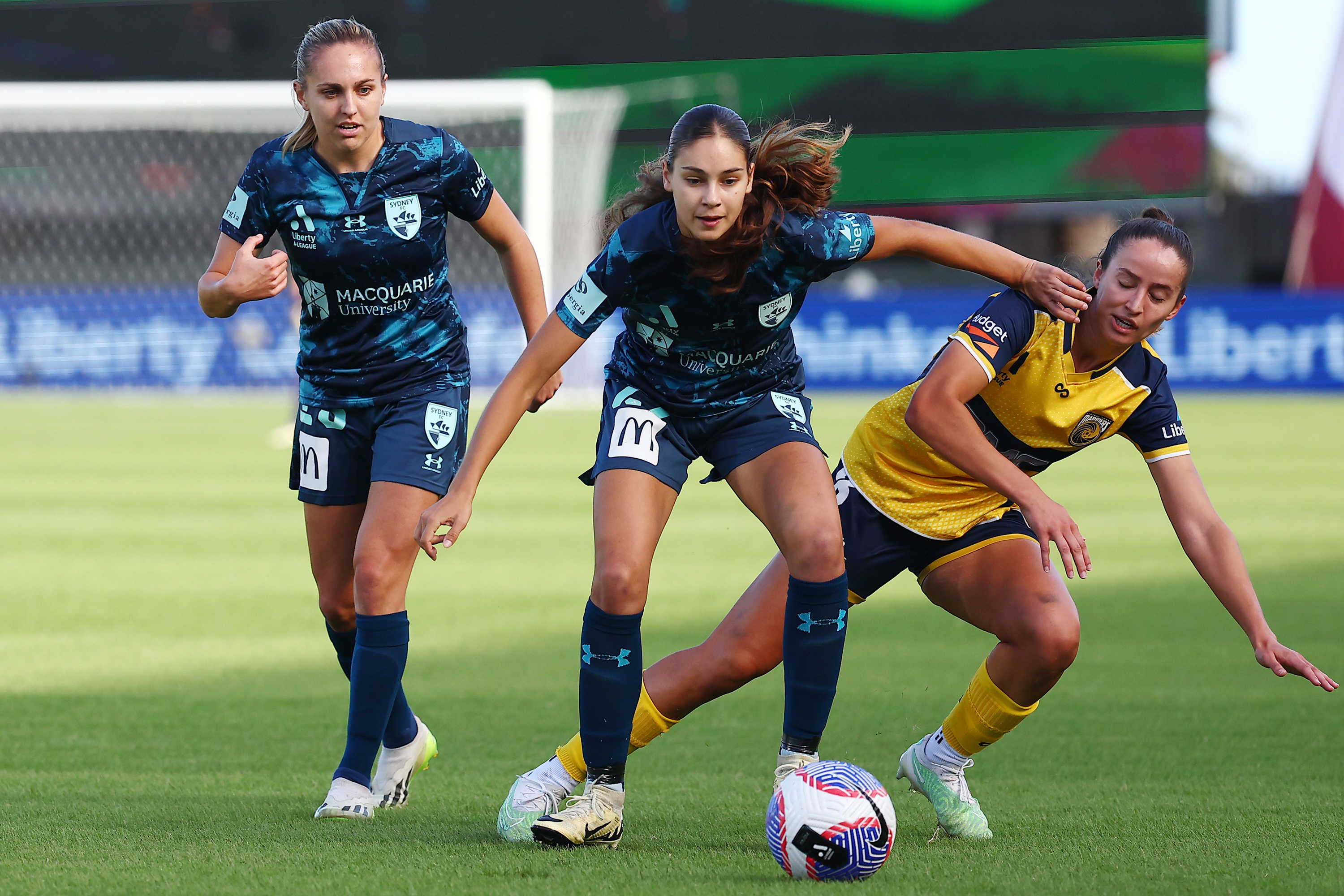 Indiana Dos Santos of Sydney FC and Bianca Galic of the Mariners challenge for the ball.