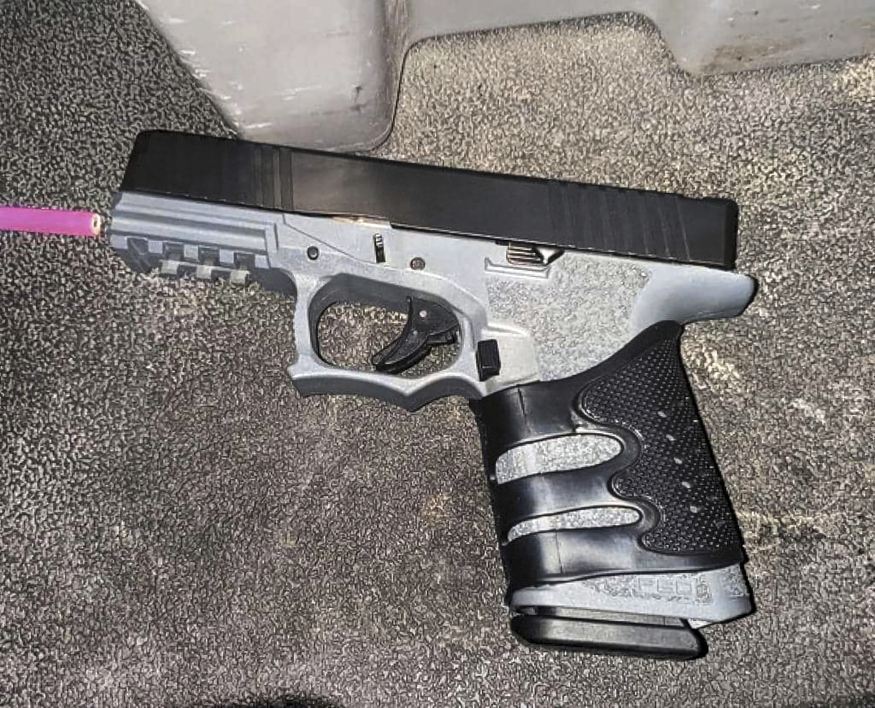 This photo provided by the Stockton Police Department shows a gun found in the possession of Wesley Brownlee, who was arrested Saturday, Oct. 15, 2022, in connection to a series of shootings. An official says that Brownlee, charged with fatally shooting three men who police said were among six victims slain by a serial killer in Northern California used a so-called ghost gun, a firearm without a serial number.(Stockton Police Department via AP)