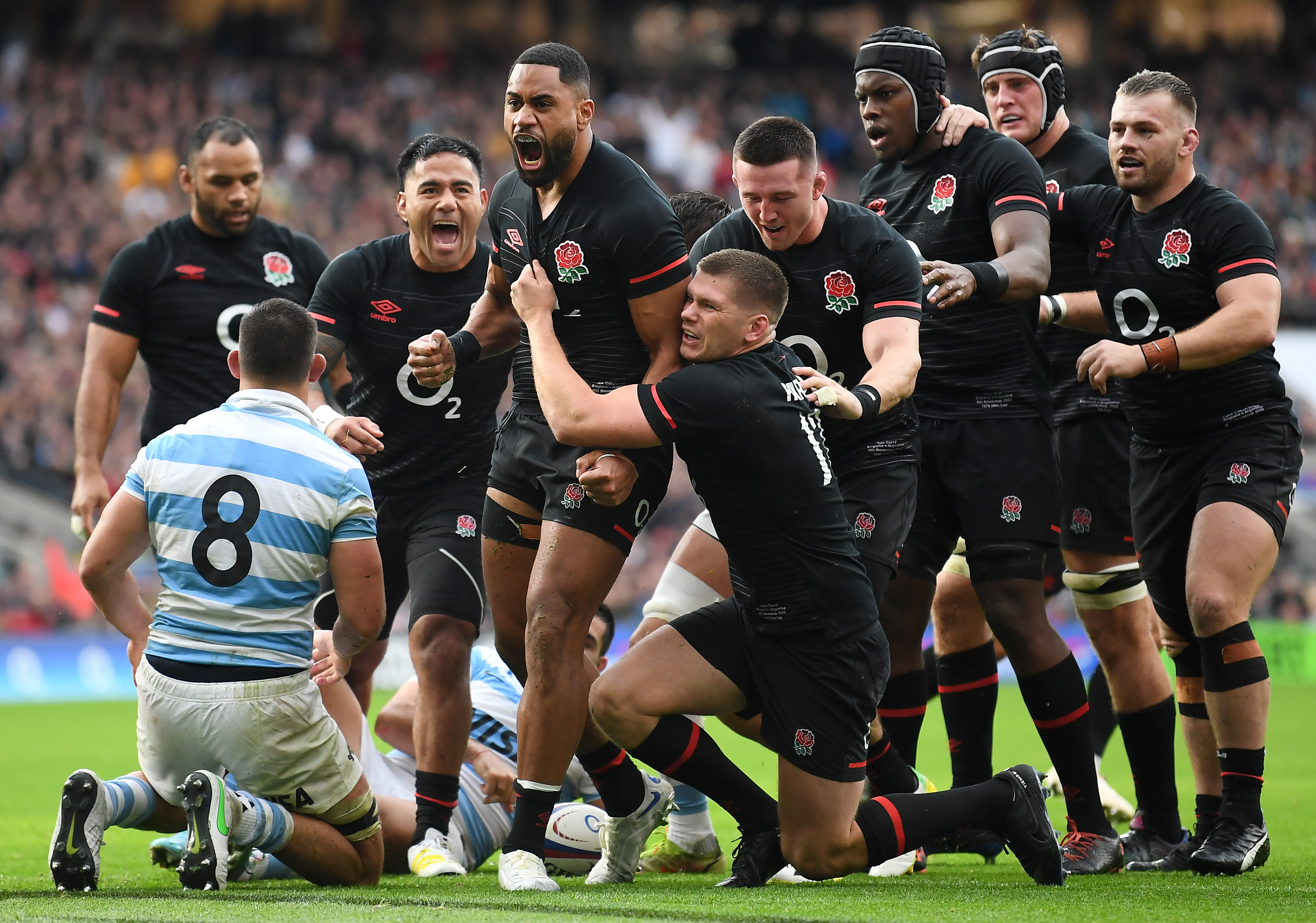 Joe Cokanasiga of England celebrates scoring their side's first try with teammates.