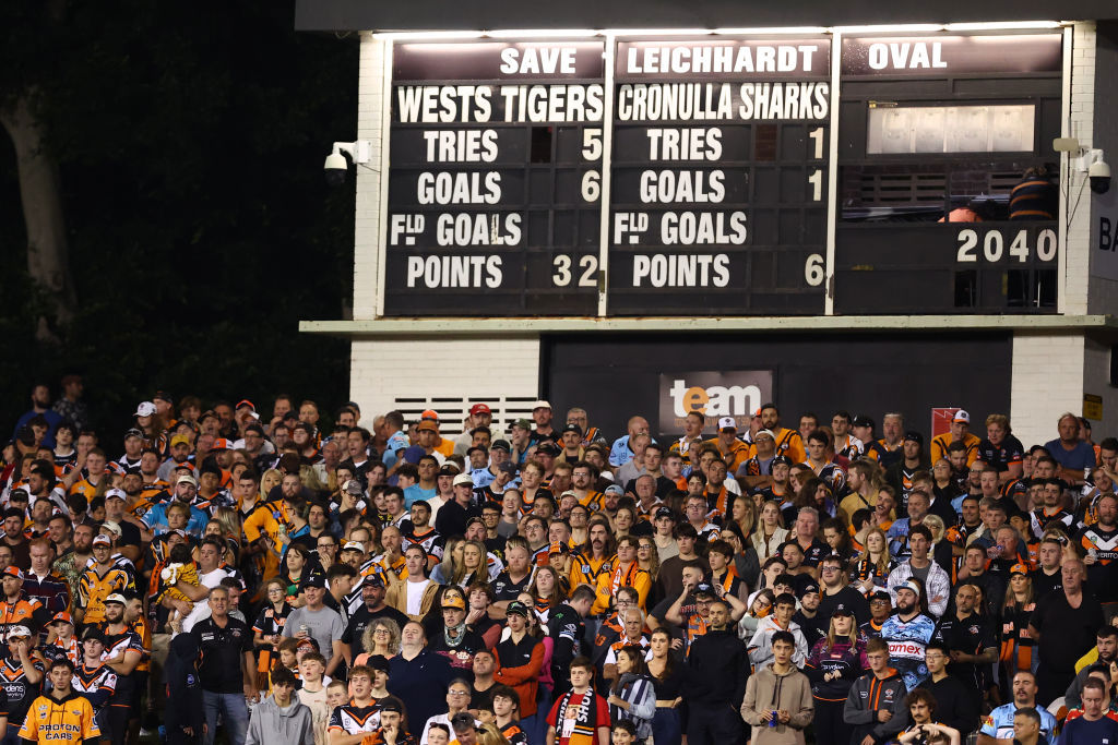 Fans watch on during the round three NRL match between Wests Tigers and Cronulla Sharks at Leichhardt Oval. 