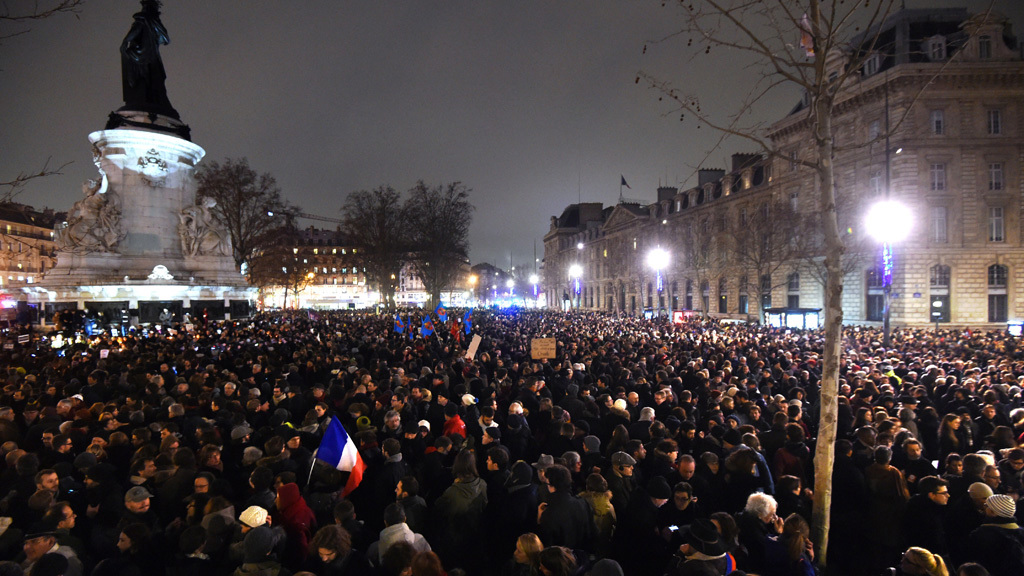 People gather at the Place de la Republique (Republic square) in Paris in honour of those killed in the Charlie Hebdo attack. (Getty)