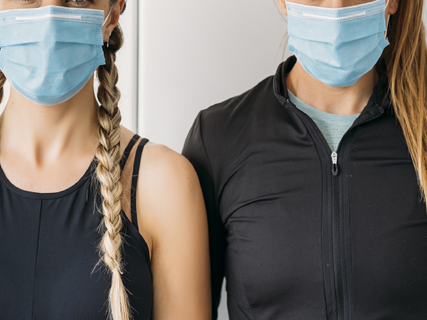 Two women wearing face masks.