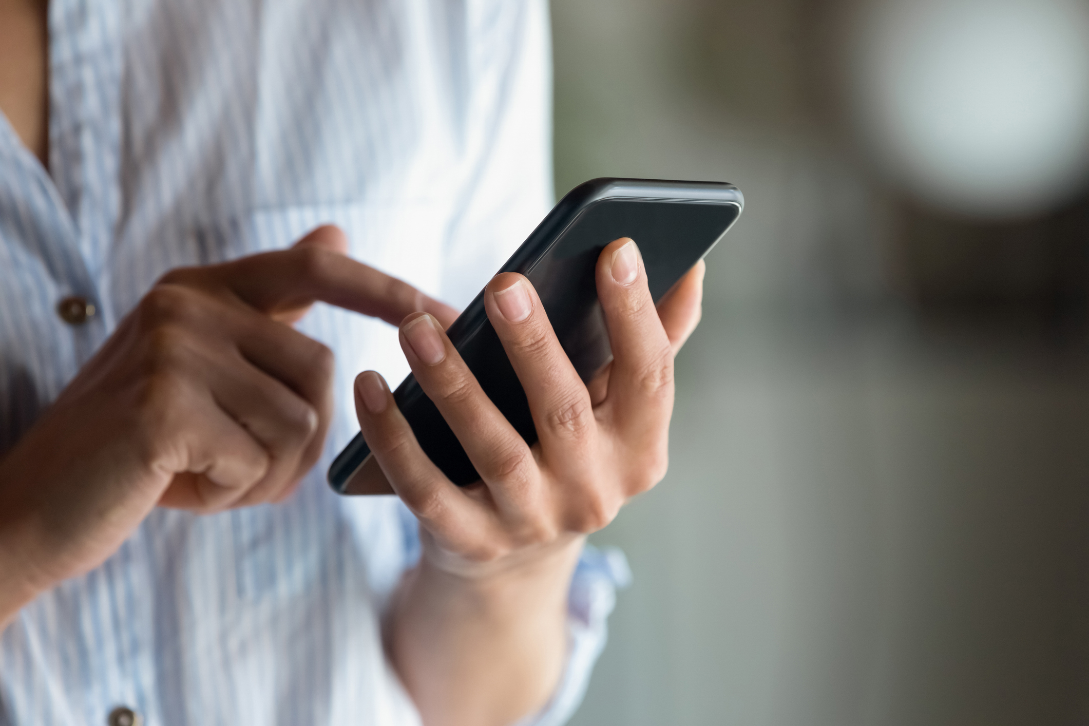 Woman scrolling her smart phone