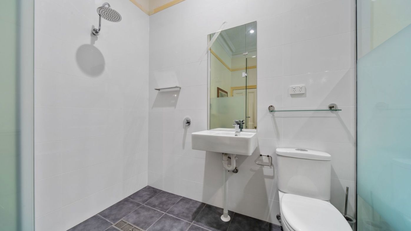 The showering facilities in the listing photo.