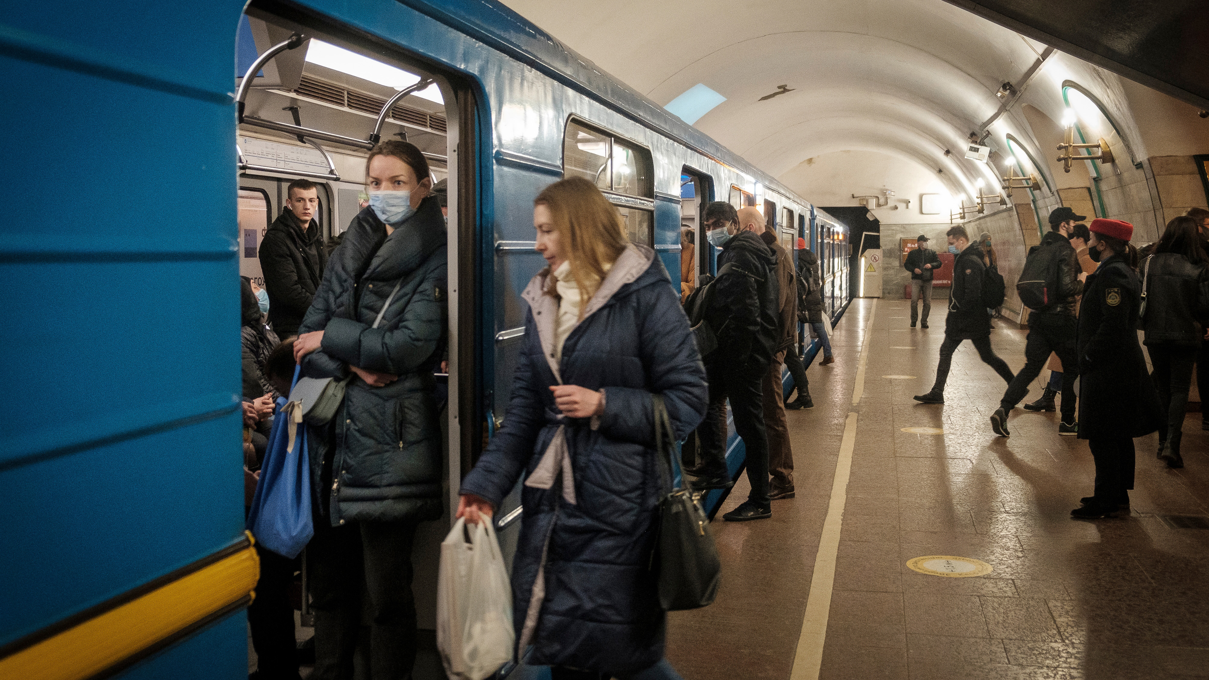 Passengers board a train at a Kyiv Metro station in Kyiv, Ukraine.