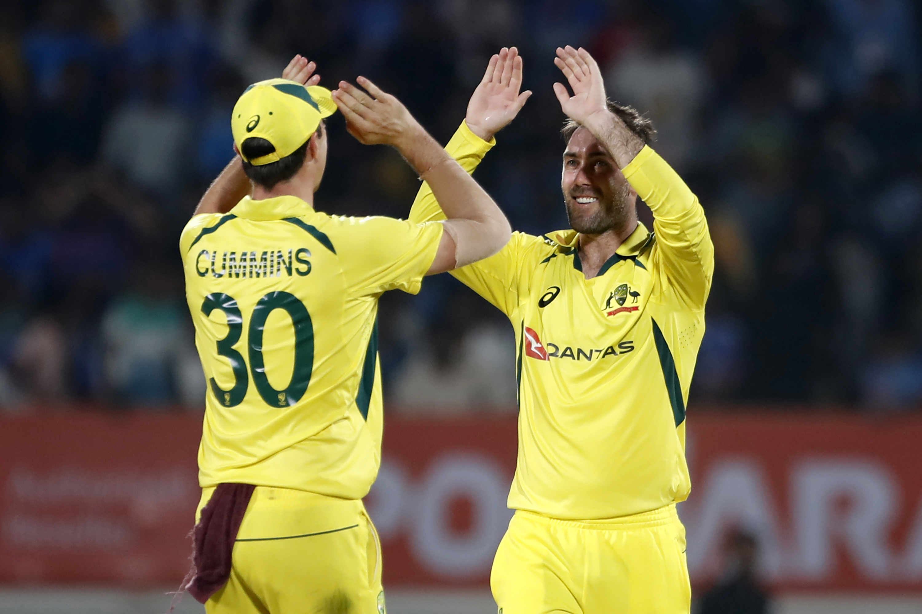 Glenn Maxwell of Australia  celebrates the wicket of Virat Kohli of India.