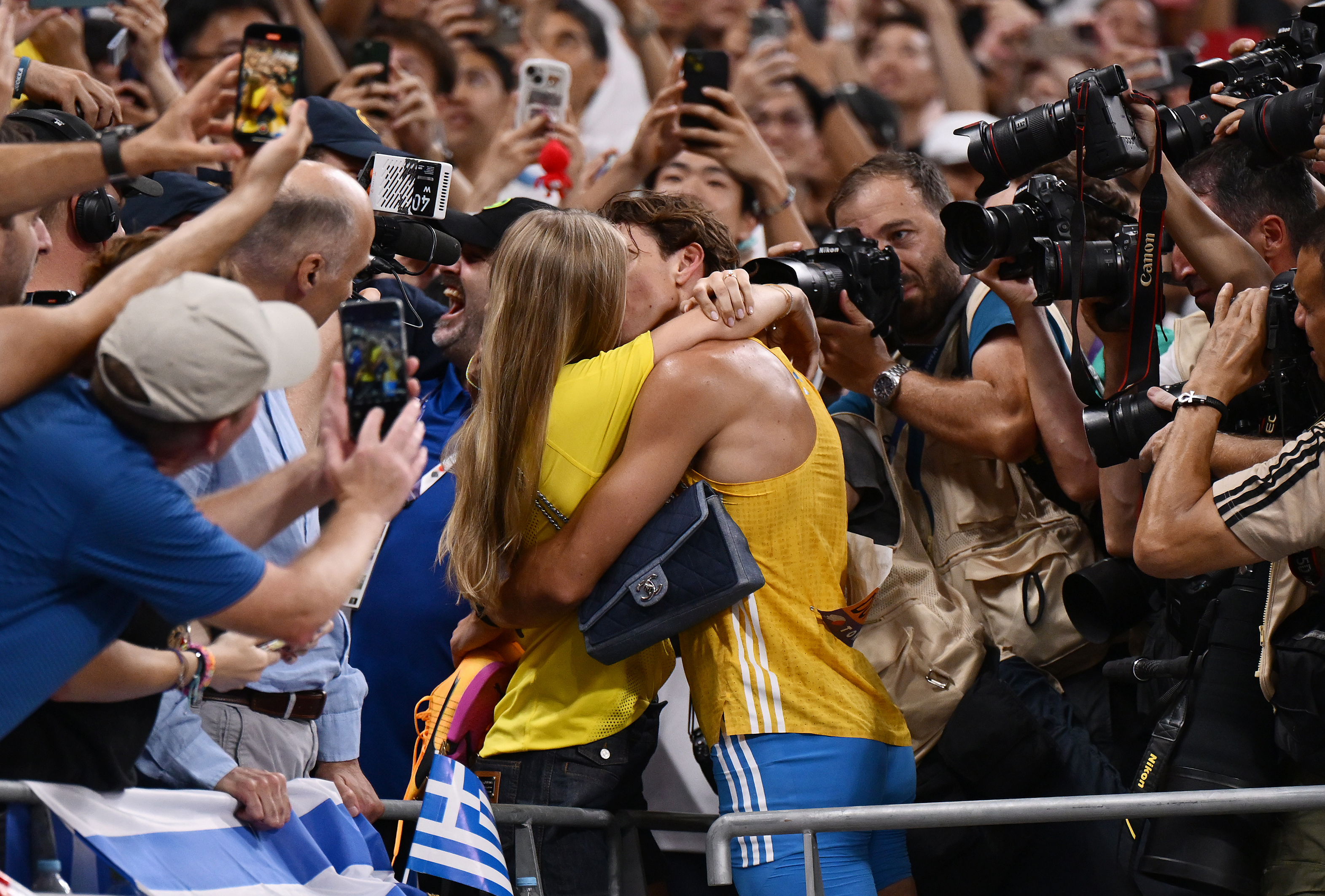Armand Duplantis and fiancée embrace.