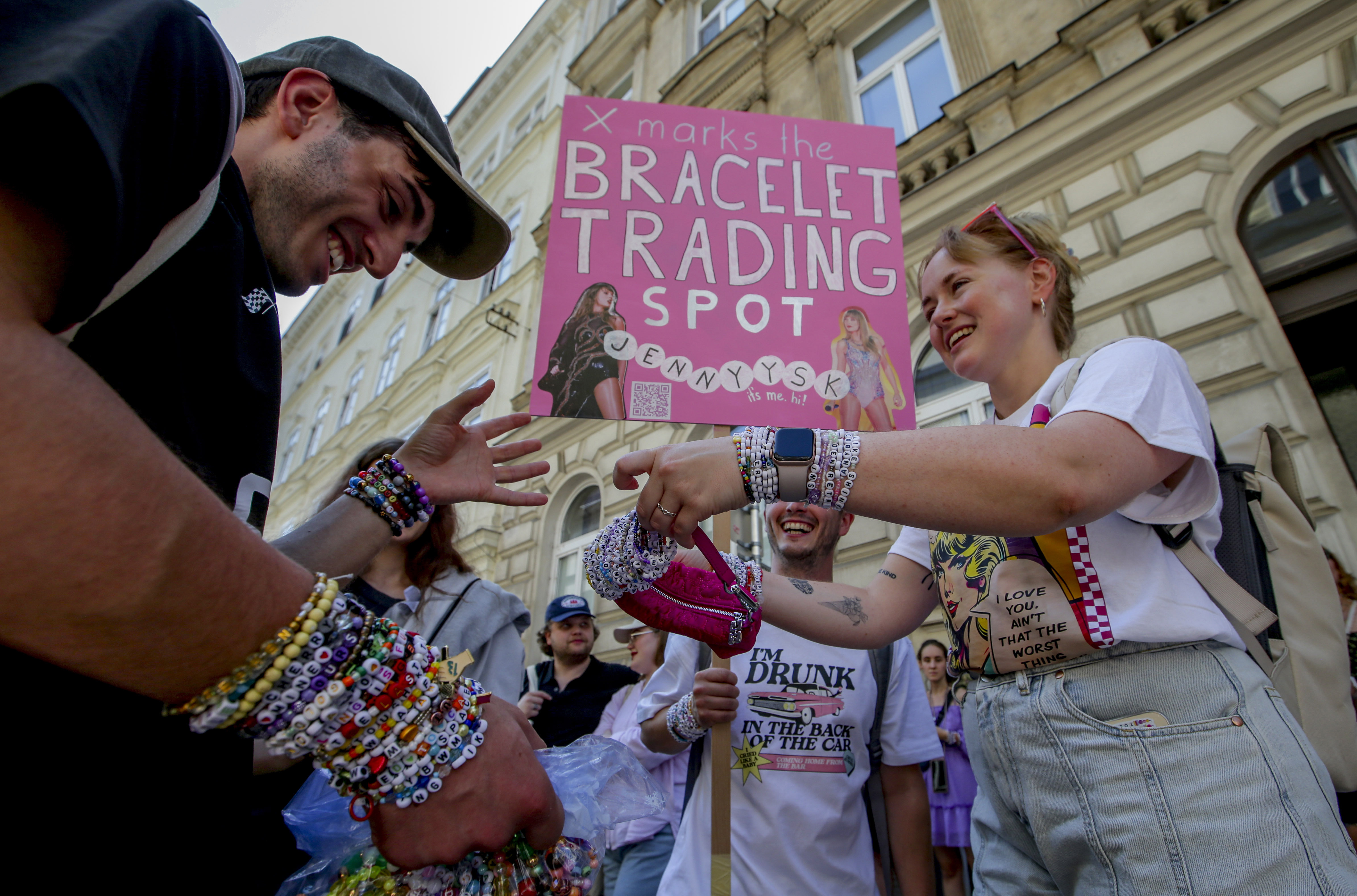 Swifties trade bracelets in the city centre in Vienna on Thursday, Aug.8, 2024. 