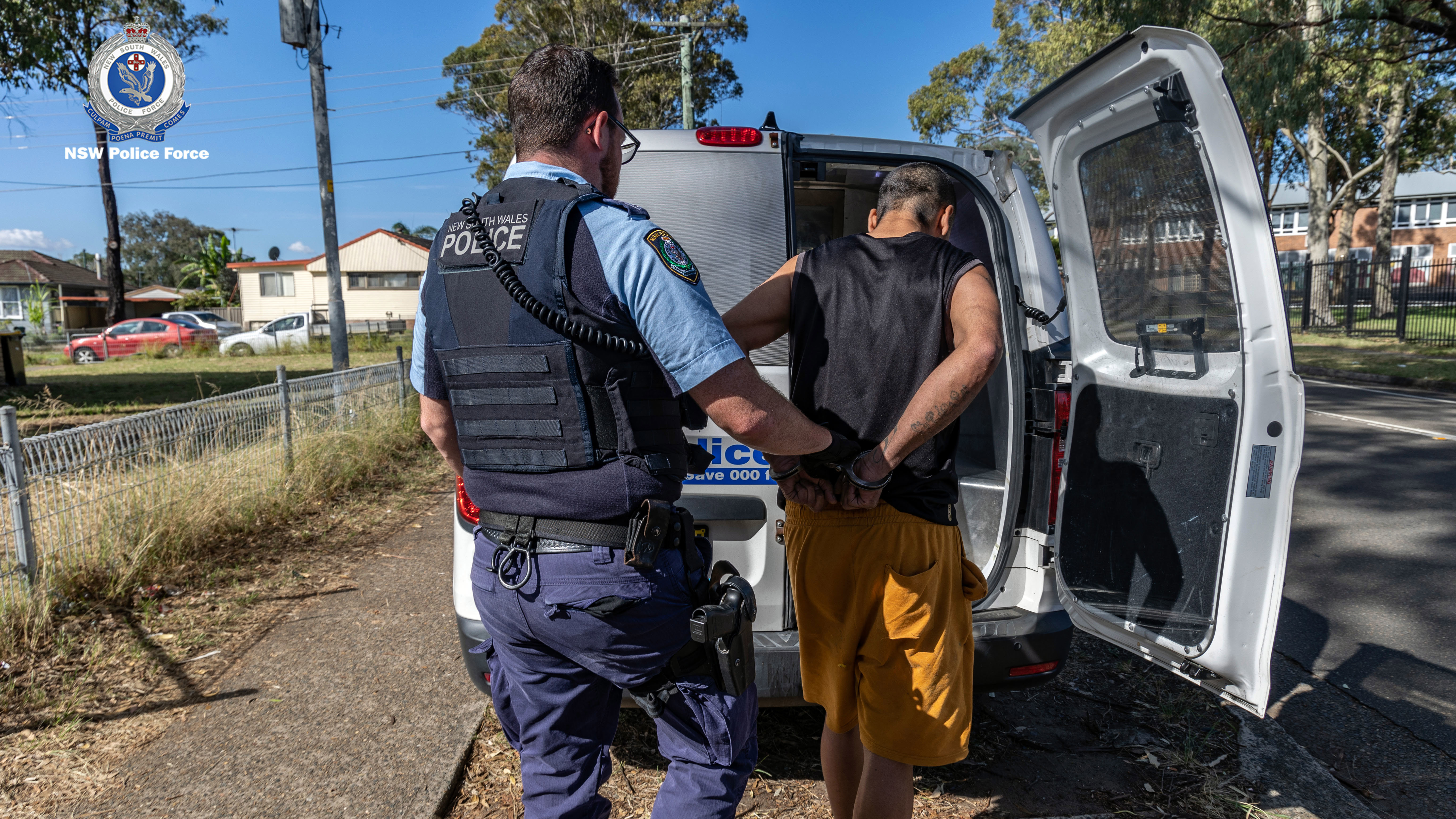 A man is arrested during Operation Amarok II, a domestic violence crackdown in NSW.