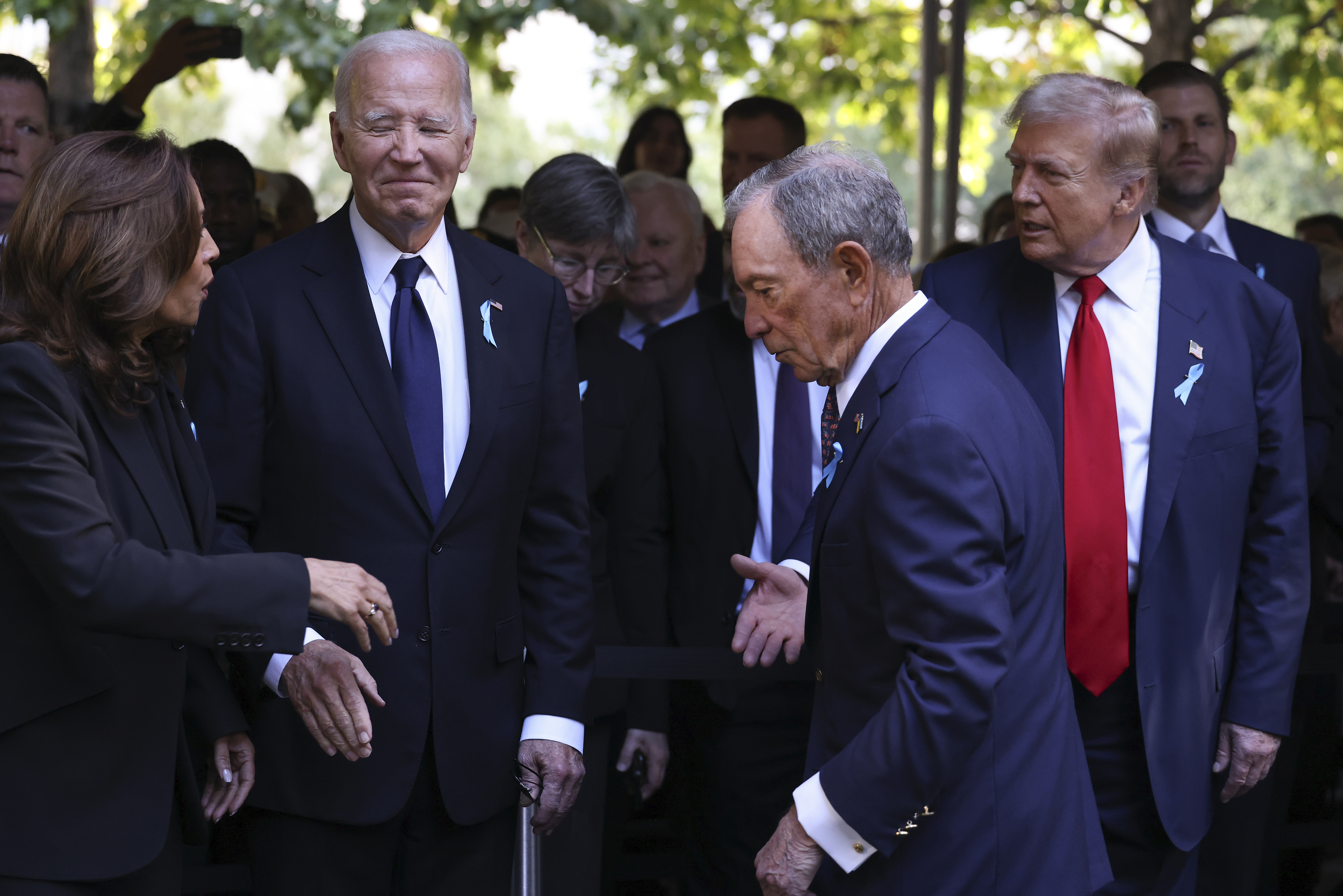 Democratic presidential nominee Vice President Kamala Harris, far left, greets Republican presidential nominee former President Donald Trump, far right, as President Joe Biden and Michael Bloomberg 