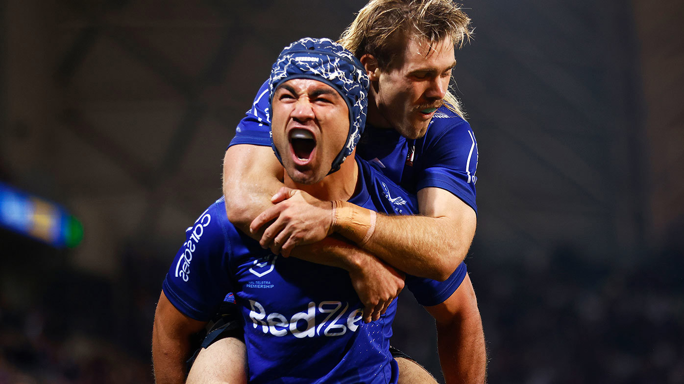 Jahrome Hughes of the Storm (L) celebrates scoring a try with Ryan Papenhuyzen 