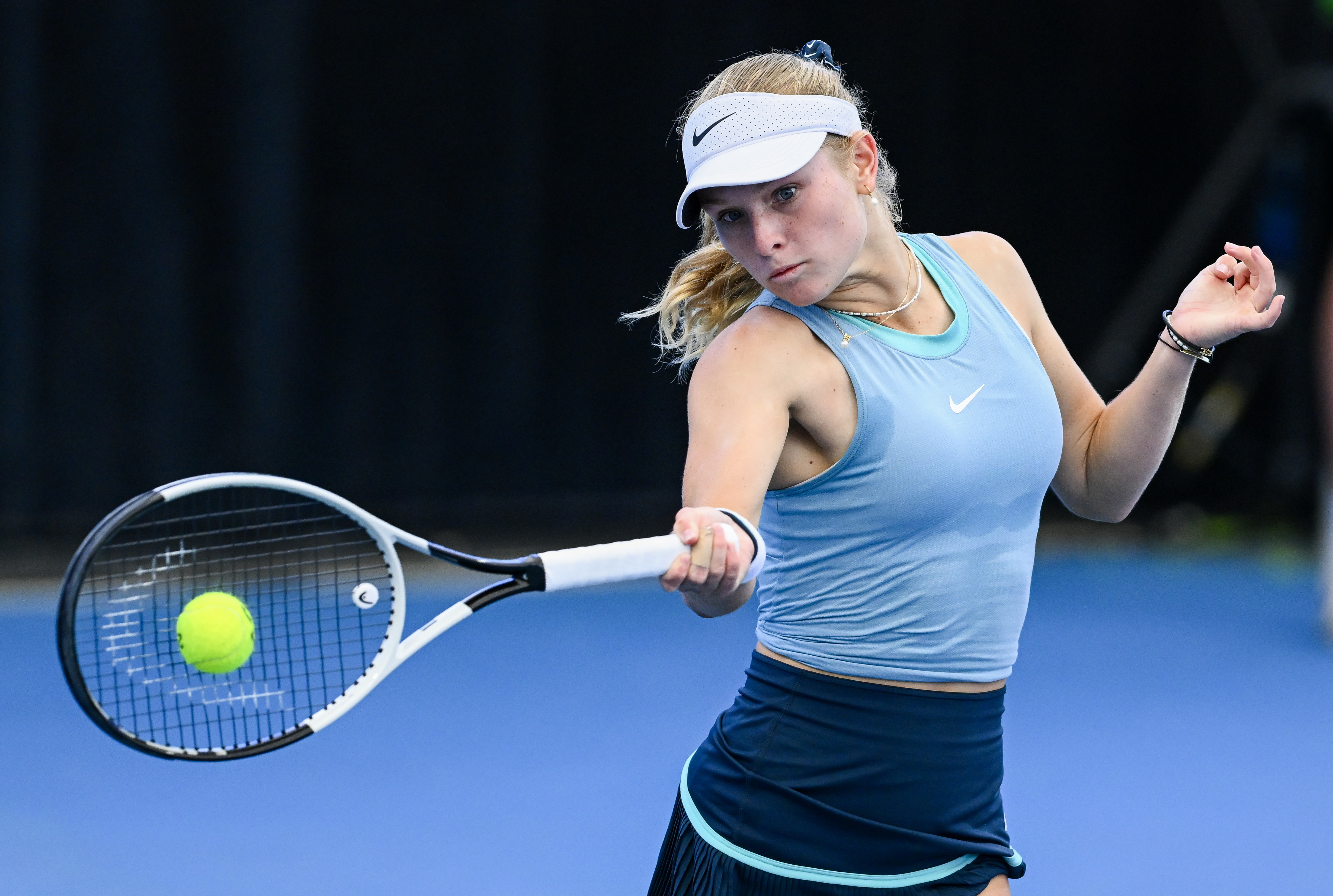 Emerson Jones plays a forehand in her match against Xinyu Wang of China on day one of the 2025 Adelaide International.