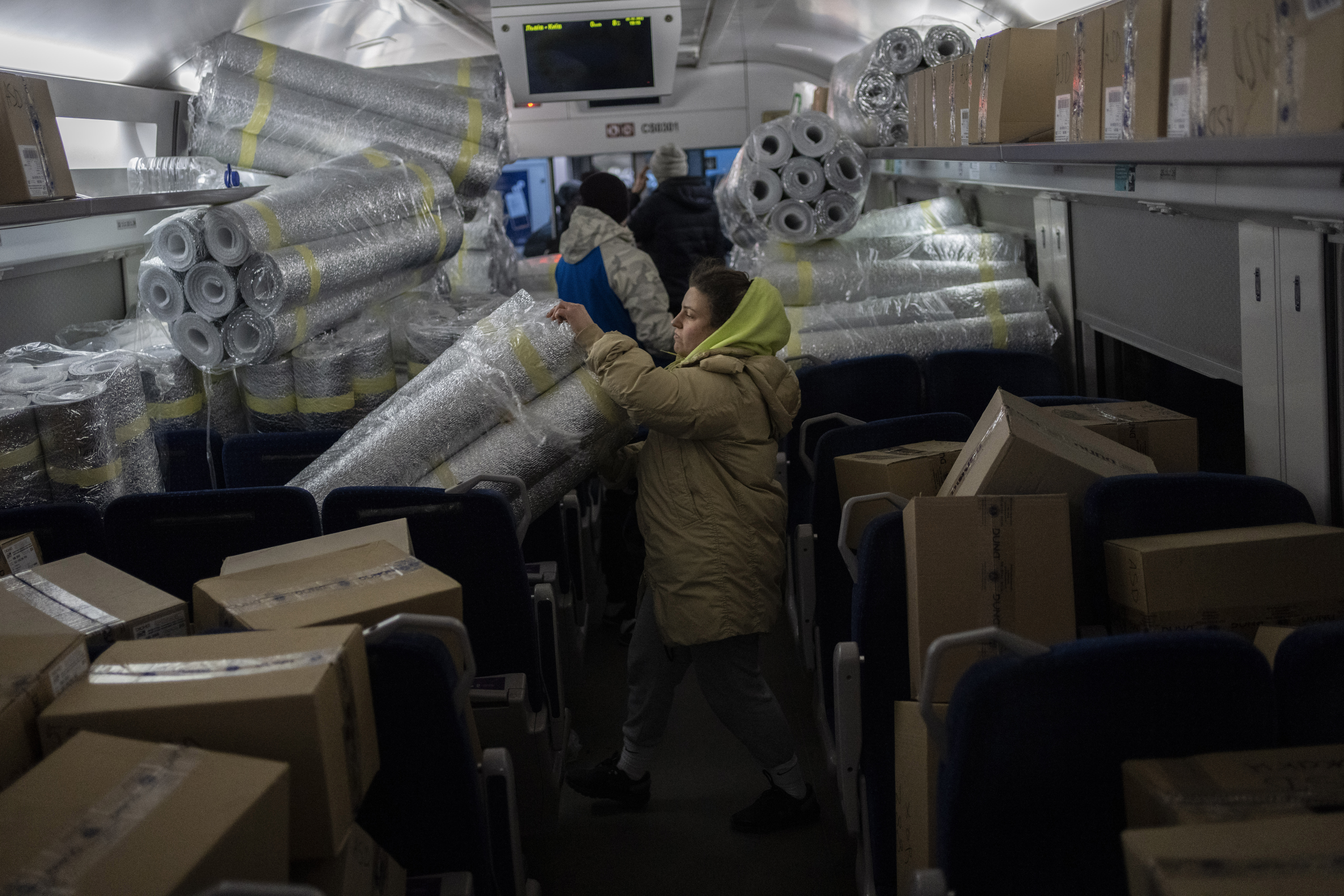 Ukrainians load relief material onto a Lviv-Kyiv train at Lviv railway station, western Ukraine on Saturday, March 5, 2022. Russian troops took control of the southern port city of Kherson this week. Although they have encircled Kharkiv, Mykolaiv, Chernihiv and Sumy, Ukrainian forces have managed to keep control of key cities in central and southeastern Ukraine, Ukrainian President Volodymyr Zelenskyy said Saturday. (AP Photo/Bernat Armangue)
