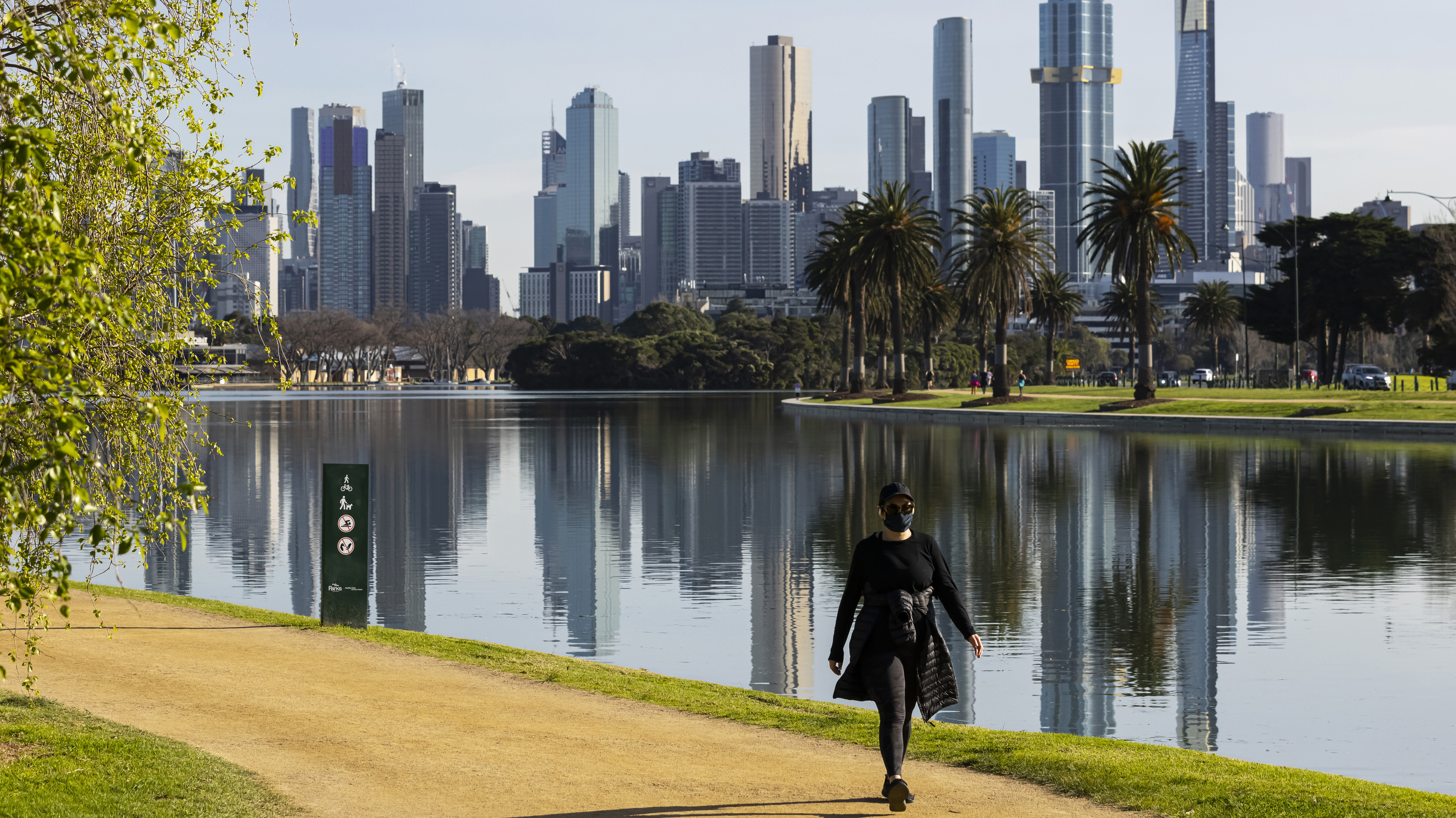 People exercising at Albert Park Lake in Melbourne