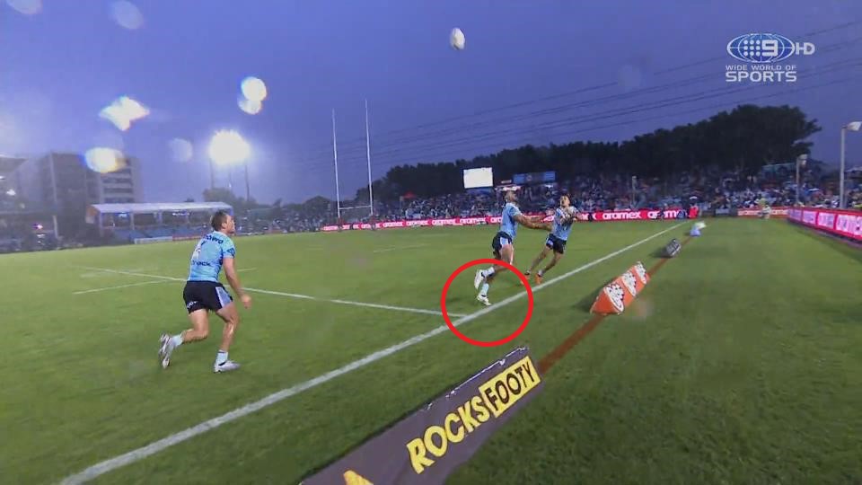 Sharks winger Ronaldo Mulitalo had his toed on the line before batting the ball back in play.