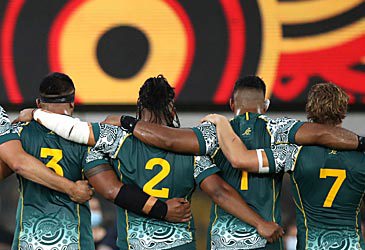 Backs of Wallabies singing Australian national anthem (Getty)