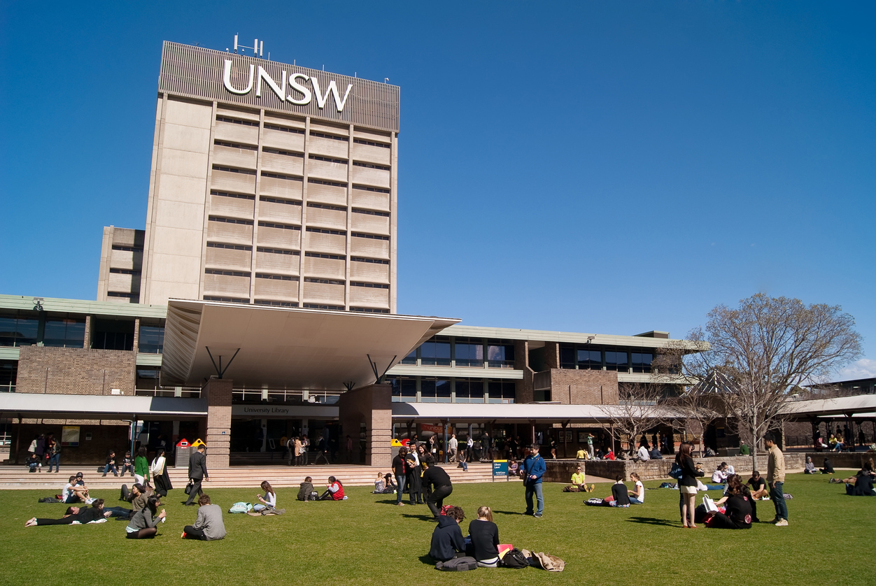 "Sydney, Australia - August 17, 2012: Students and graduates converge on a lawn before the University of New South Wales (UNSW) library on a clear winter morning."