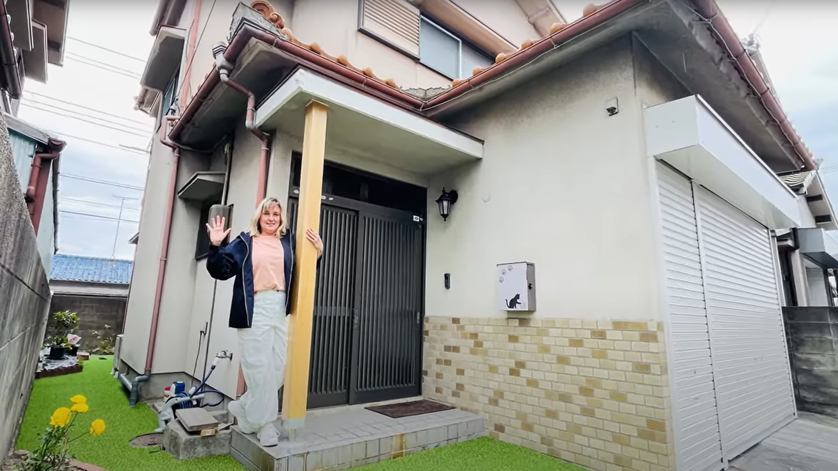 Chani, pictured outside the abandoned home she bought in Wakayama for $20,000.