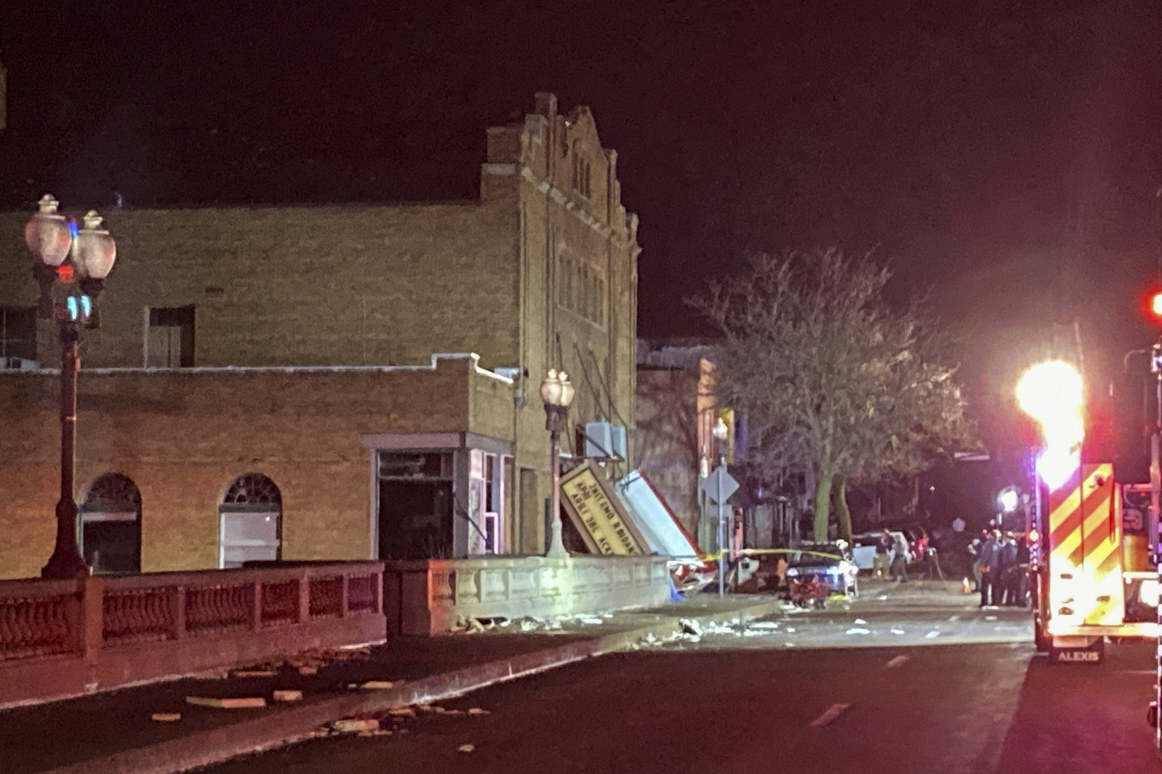The fallen marquee is seen at the front entrance of the Apollo Theatre where a roof collapsed during a tornado in Belvidere, Ill., during a heavy metal concert, late Friday, March 31, 2023. 