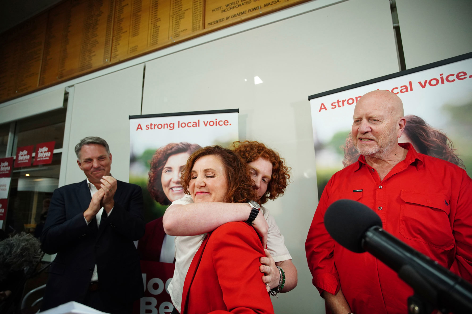 Successful candidate for Dunkley Jodie Belyea celebrates with a hug from her son Flynn Glazebrook at the Frankston Bowling Club after winning the Dunkley by-election on Saturday 2 March 2024.