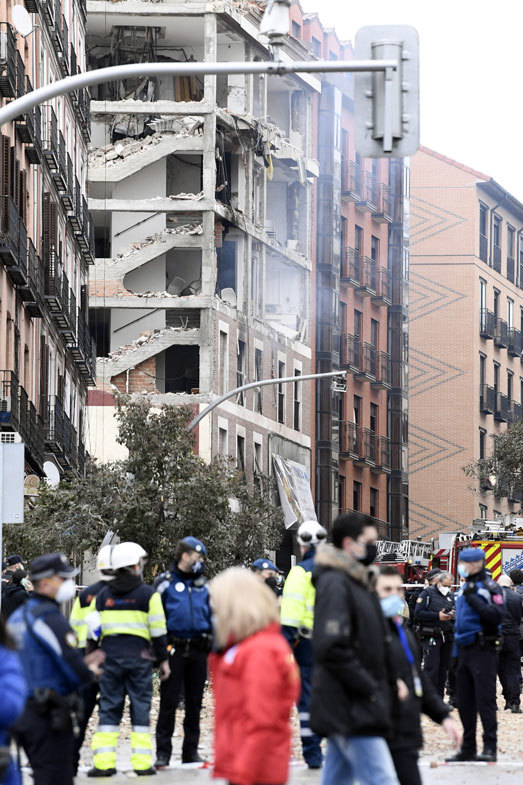 Emergency services at the scene after six floors have collapsed on a building after a large explosion on Toledo Street in central Madrid on January 20, 2021 in Madrid, Spain.