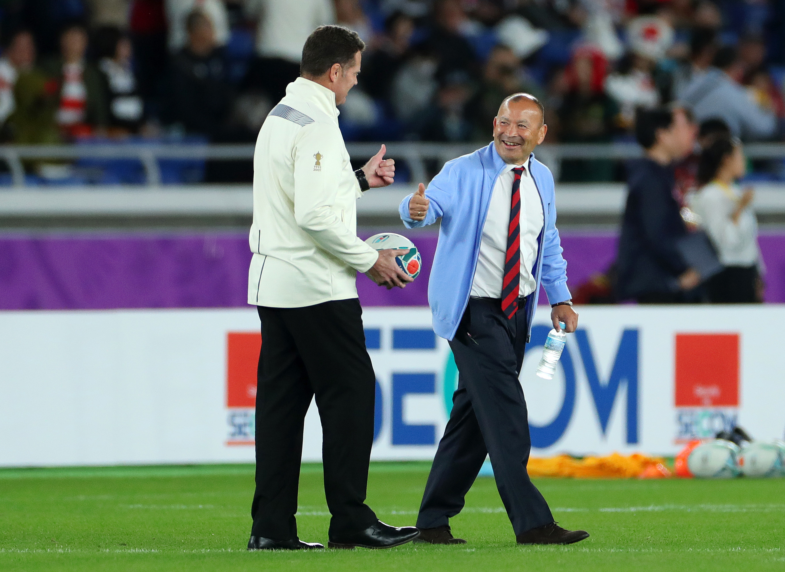 Eddie Jones gestures after shaking hands with Rassie Erasmus.