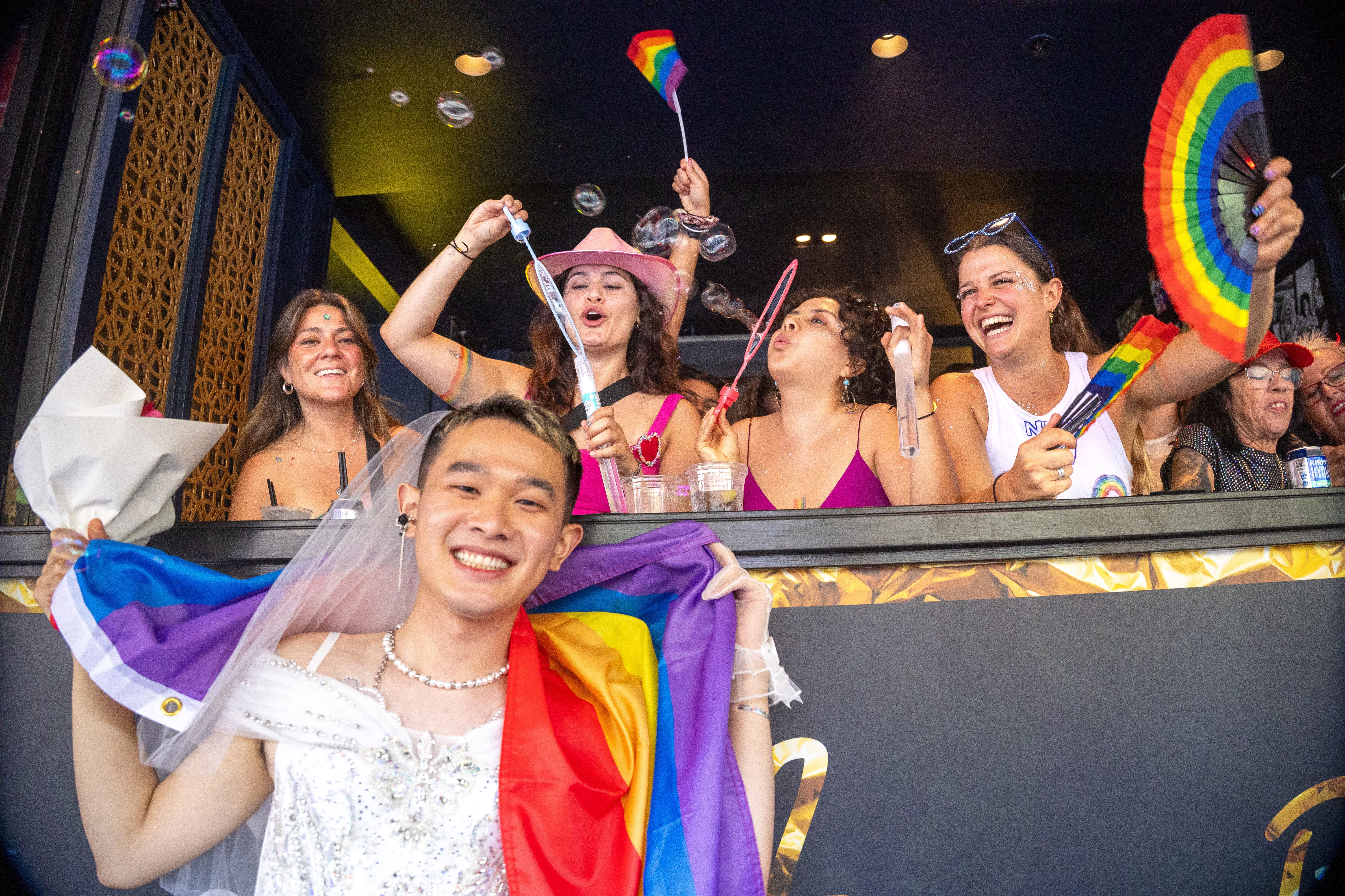 Crowds gather on Oxford Street for the 2026 Mardi Gras parade in Sydney.