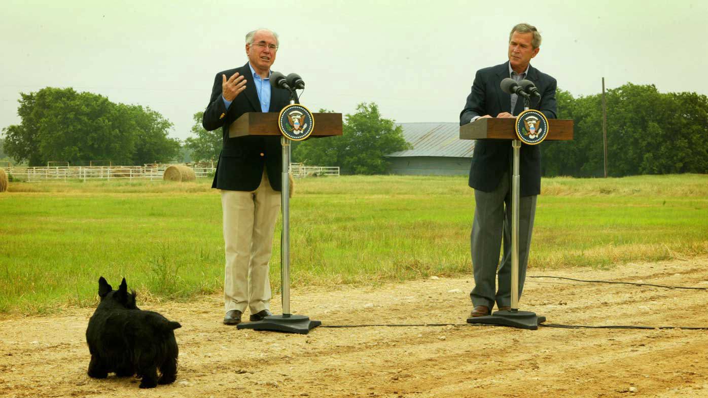 Presidential pooch Barney gatecrashes a press conference with John Howard and George W Bush in 2003.