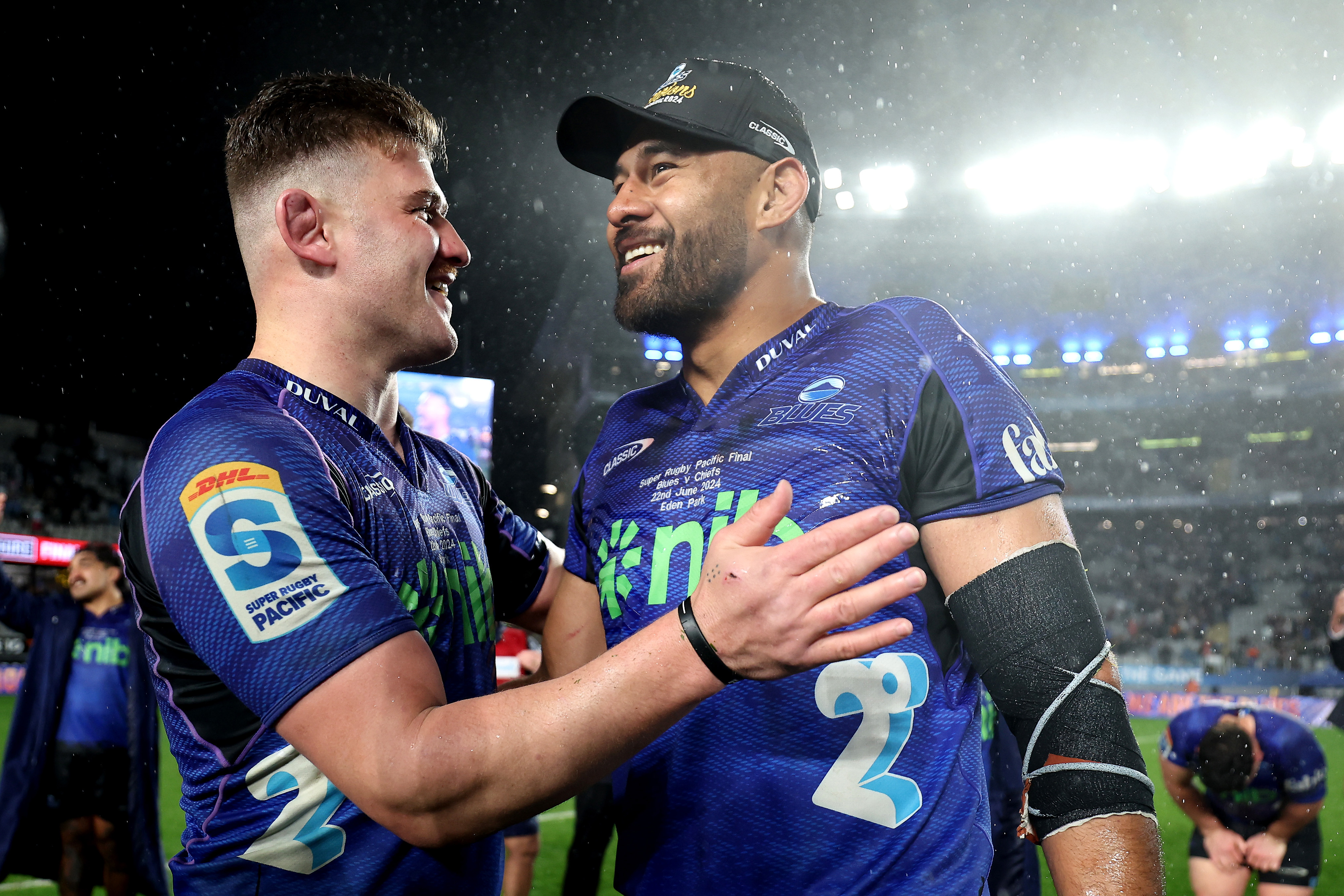 Dalton Papalii and Patrick Tuipulotu of the Blues celebrate after winning.