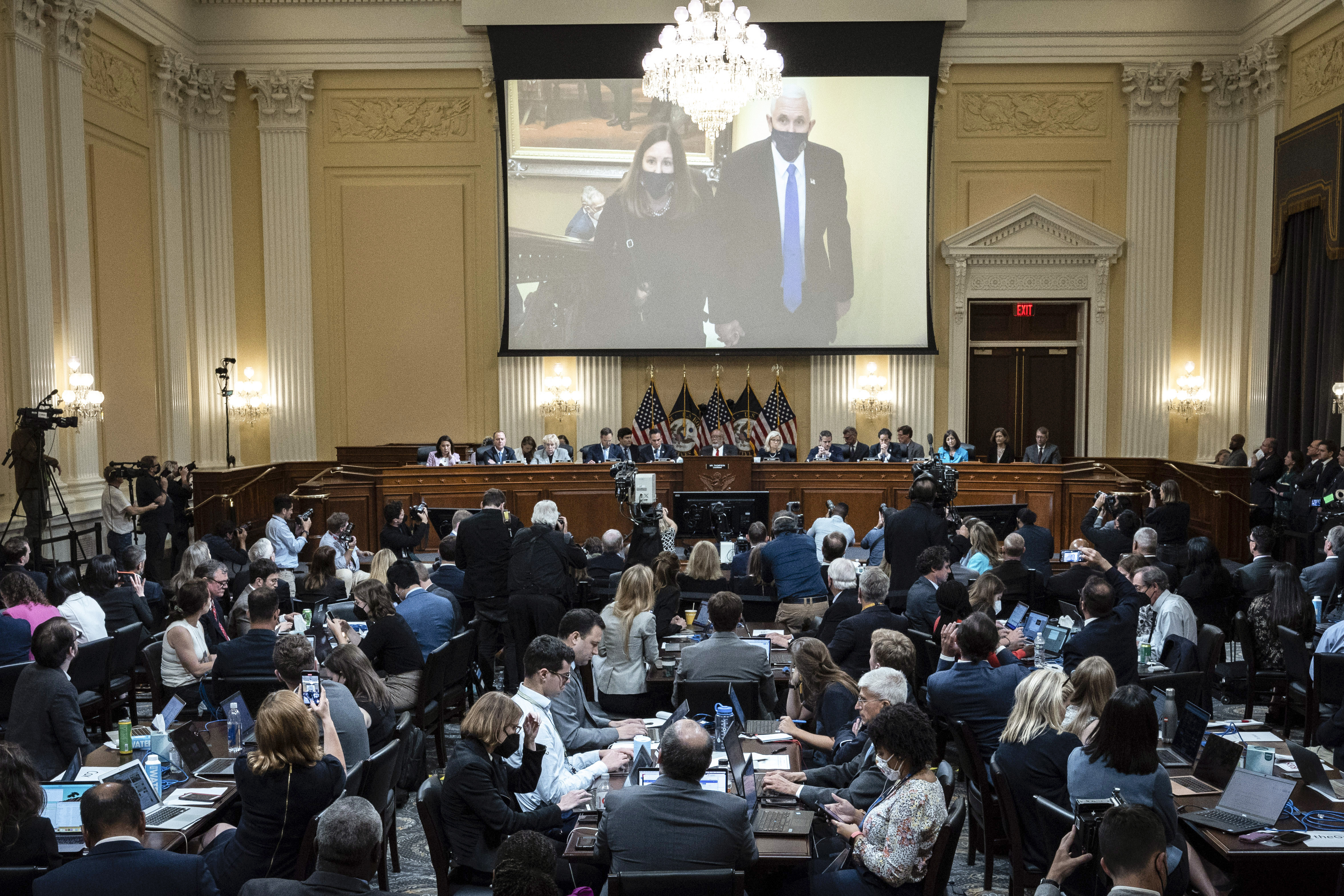 A committee exhibit shows former Vice President Mike Pence and his wife Karen, as the House select committee investigating the Jan. 6, 2021, attack on the Capitol holds a hearing at the Capitol in Washington, Thursday, June 16, 2022. (Drew Angerer/Pool Photo via AP)