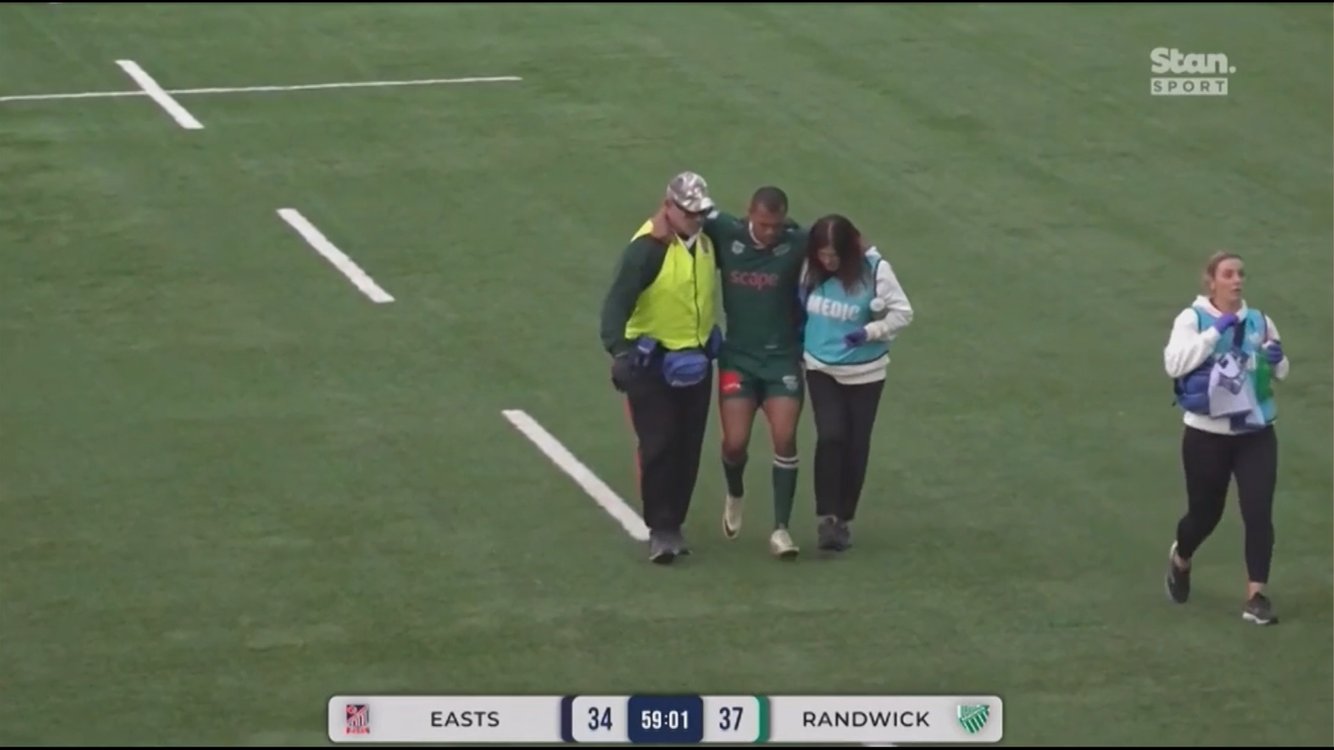 Kurtley Beale is helped off the field.