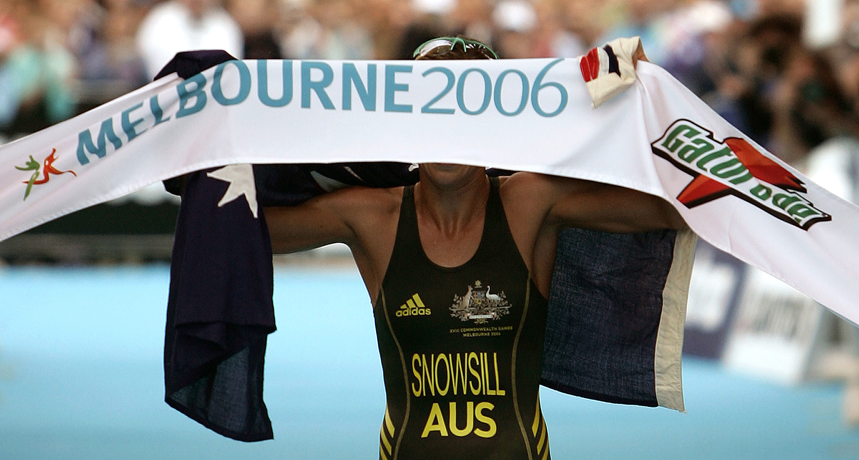 Australian Emma Snowsill celebrates as she crossed the finish line to win the women's triathlon at the Commonwealth Games in Melbourne