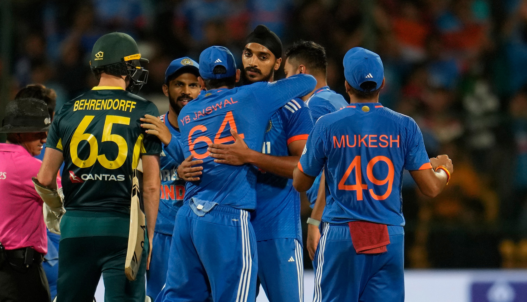 India's players celebrate beating Australia in the fifth Twenty20.