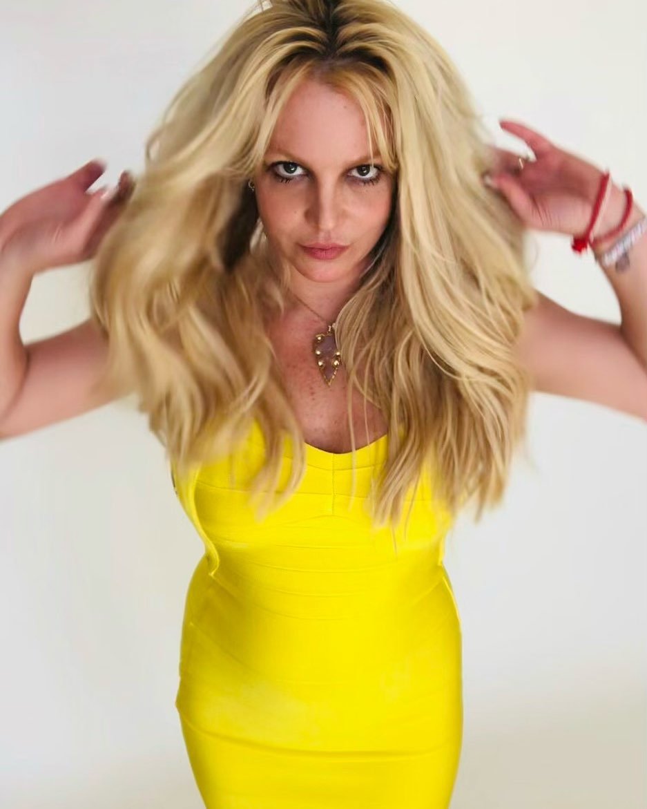 Britney Spears celebrates newfound freedom from conservatorship by donning a yellow dress in an Instagram post