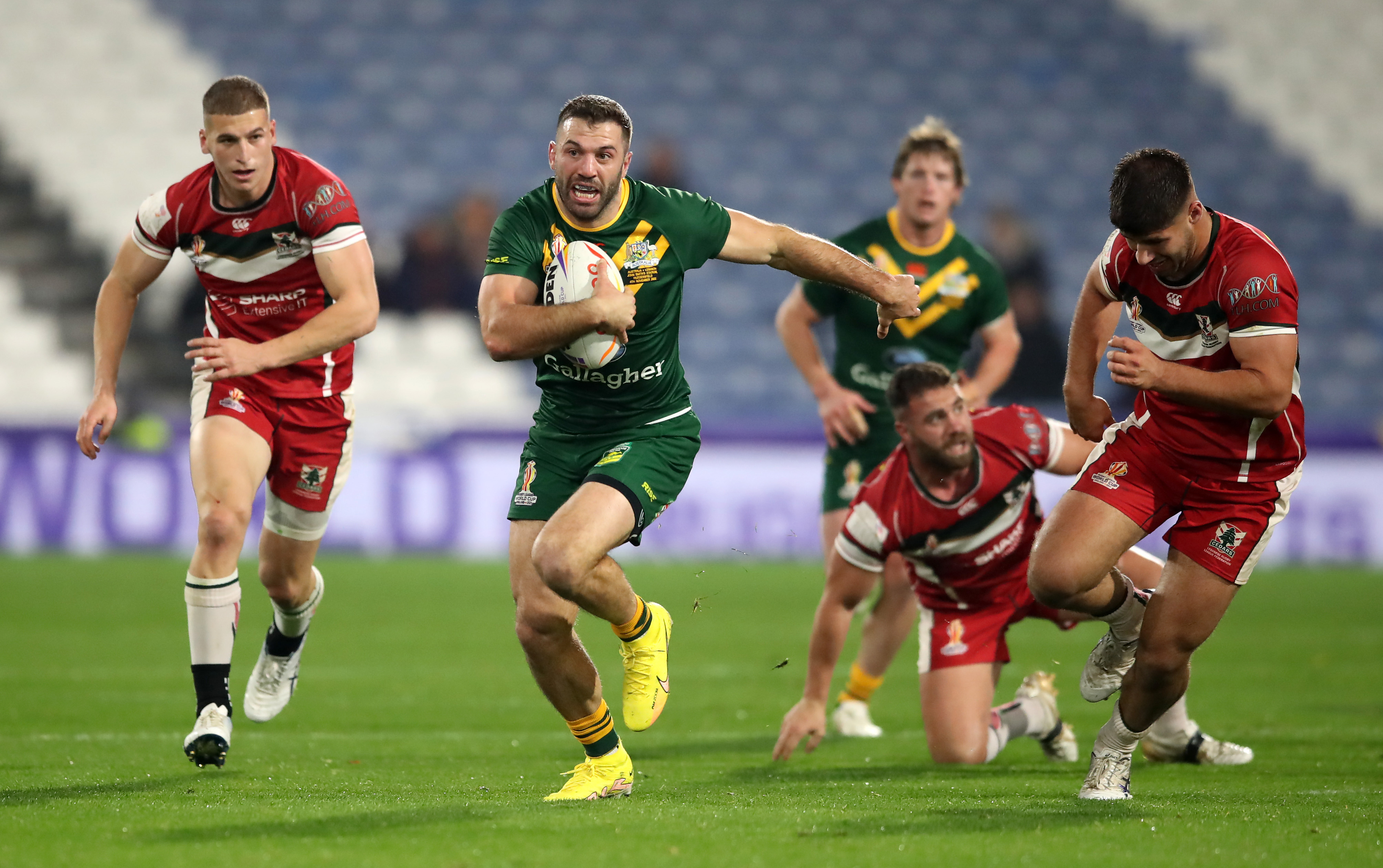James Tedesco runs with the ball.