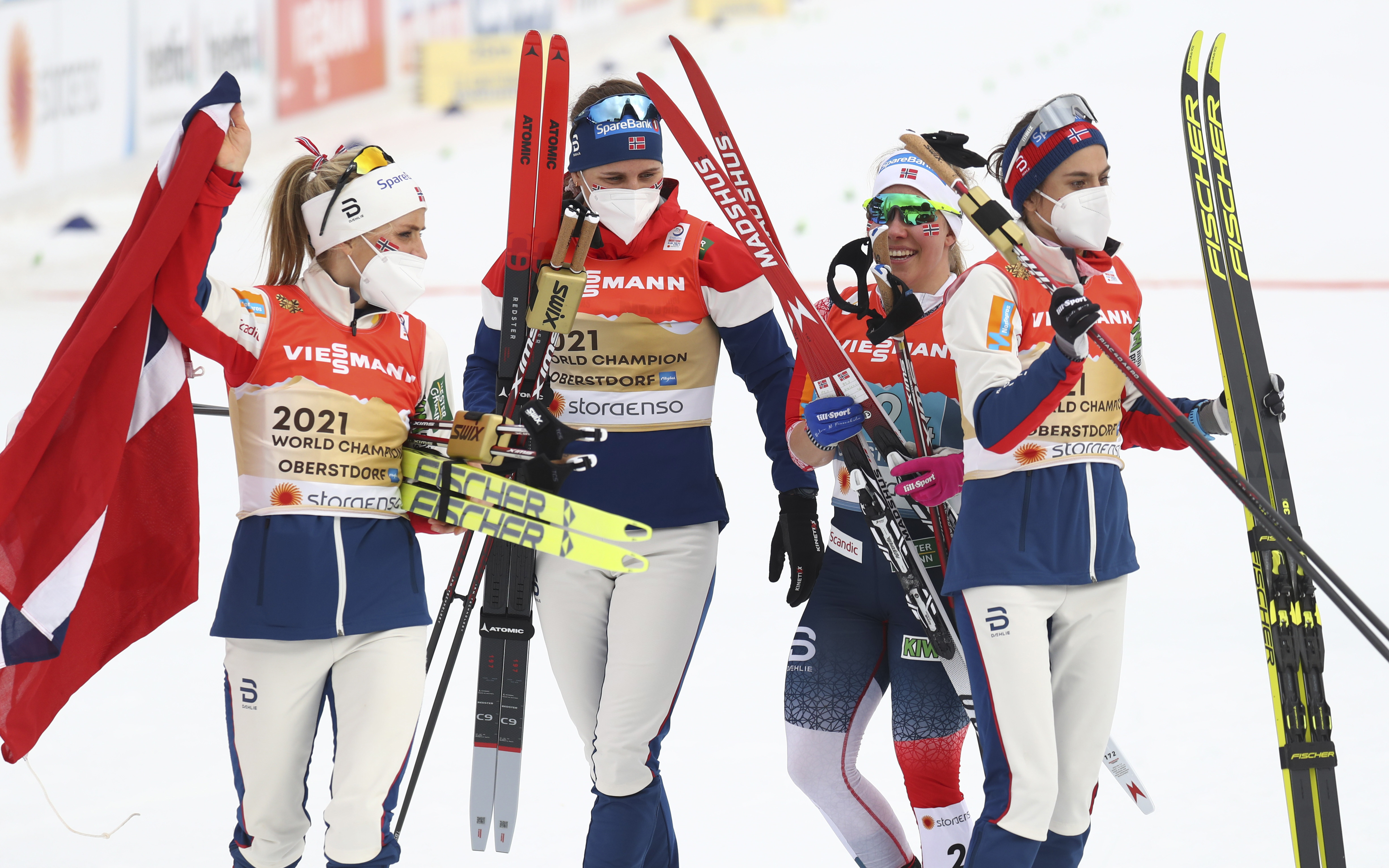 Team Norway's Helene Marie Fossesholm, Udnes Weng, Therese Johaug and Heidi Weng celebrate after winning the WSC Women's Relay 4x5km cross country event.