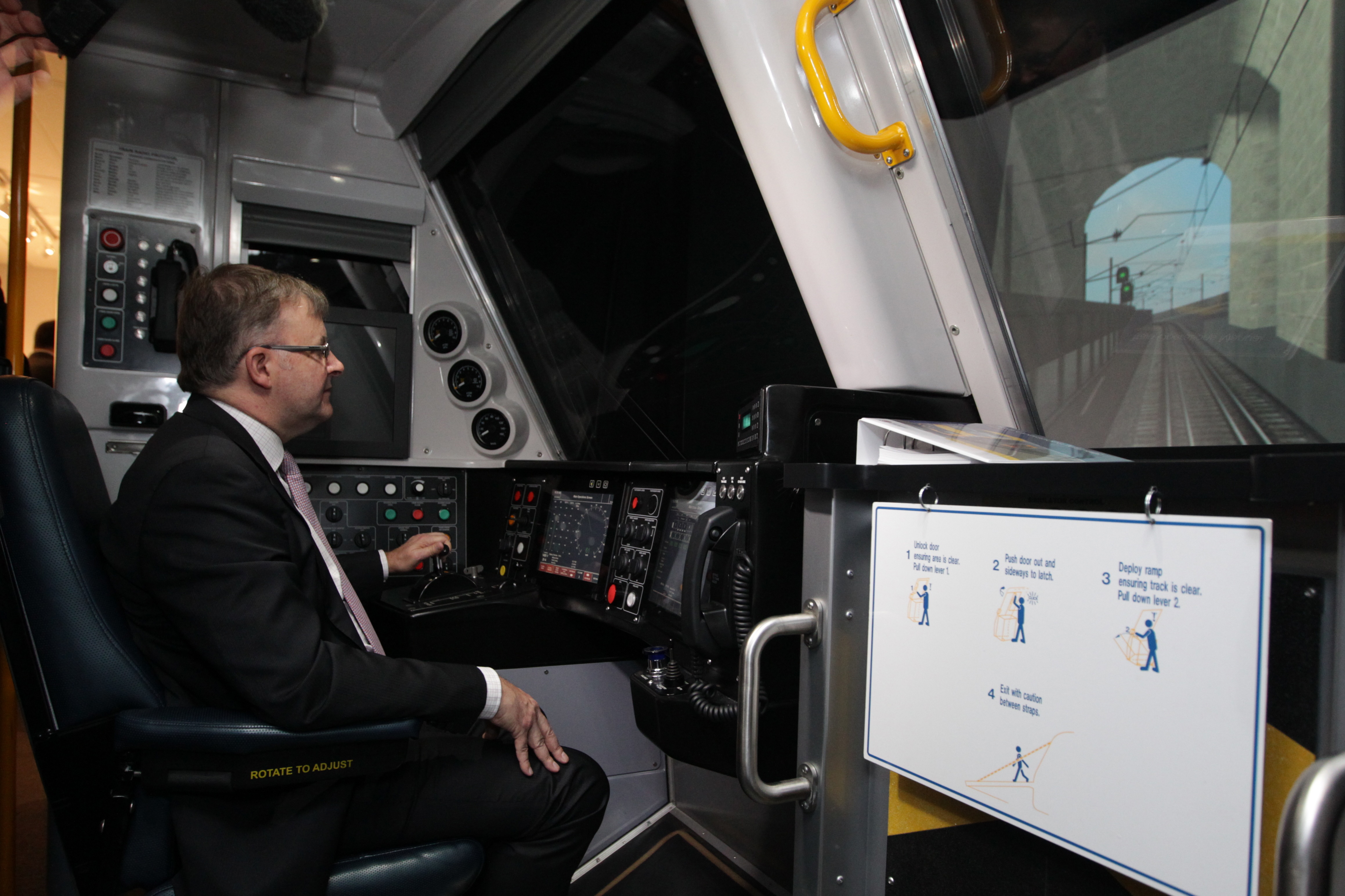 Then-Infrastructure and Transport Minister Anthony Albanese drives a train using a simulator parked behind Old Parliament House, in Canberra on Monday 26 November 2012.