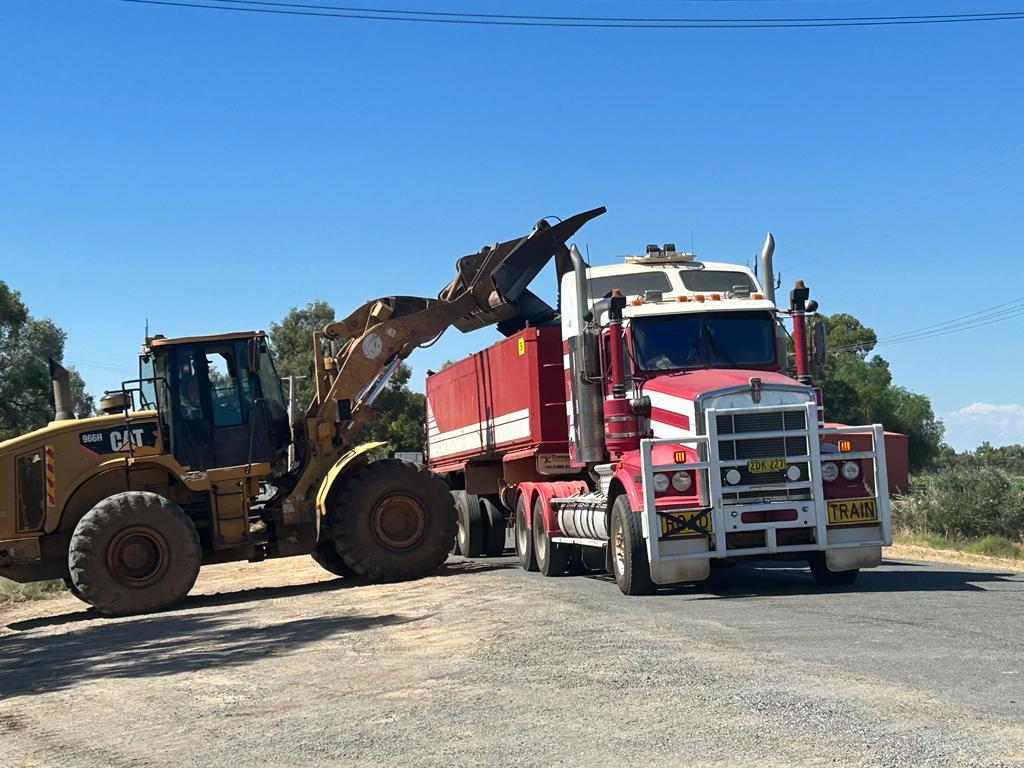 NSW Police clear dead fish from Main Weir Pool in Menindee.