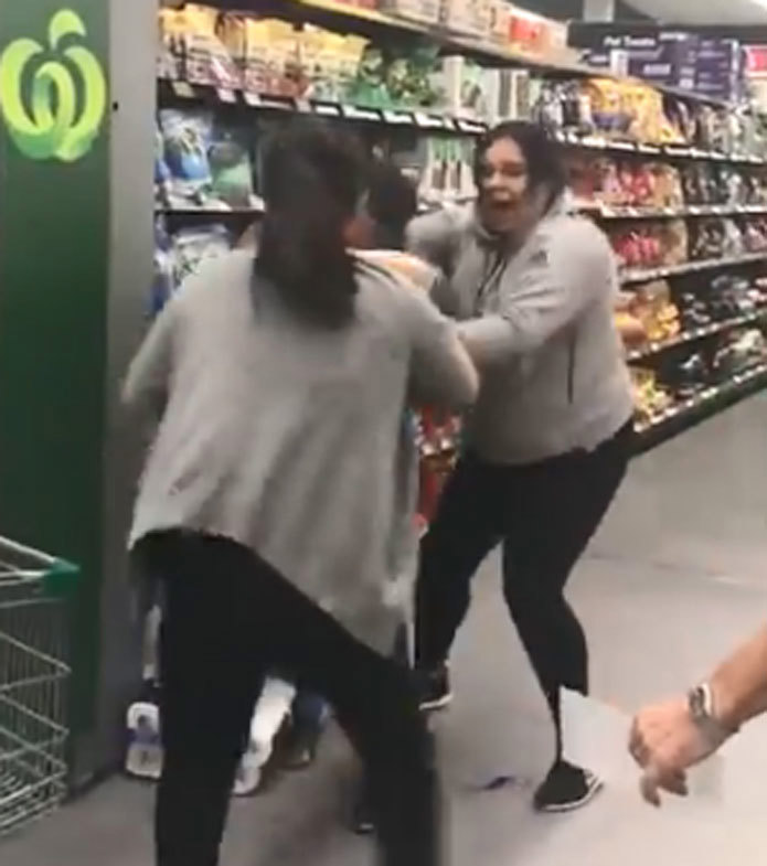 A mother and daughter jostled with another shopper at the Chullora Woolworths.