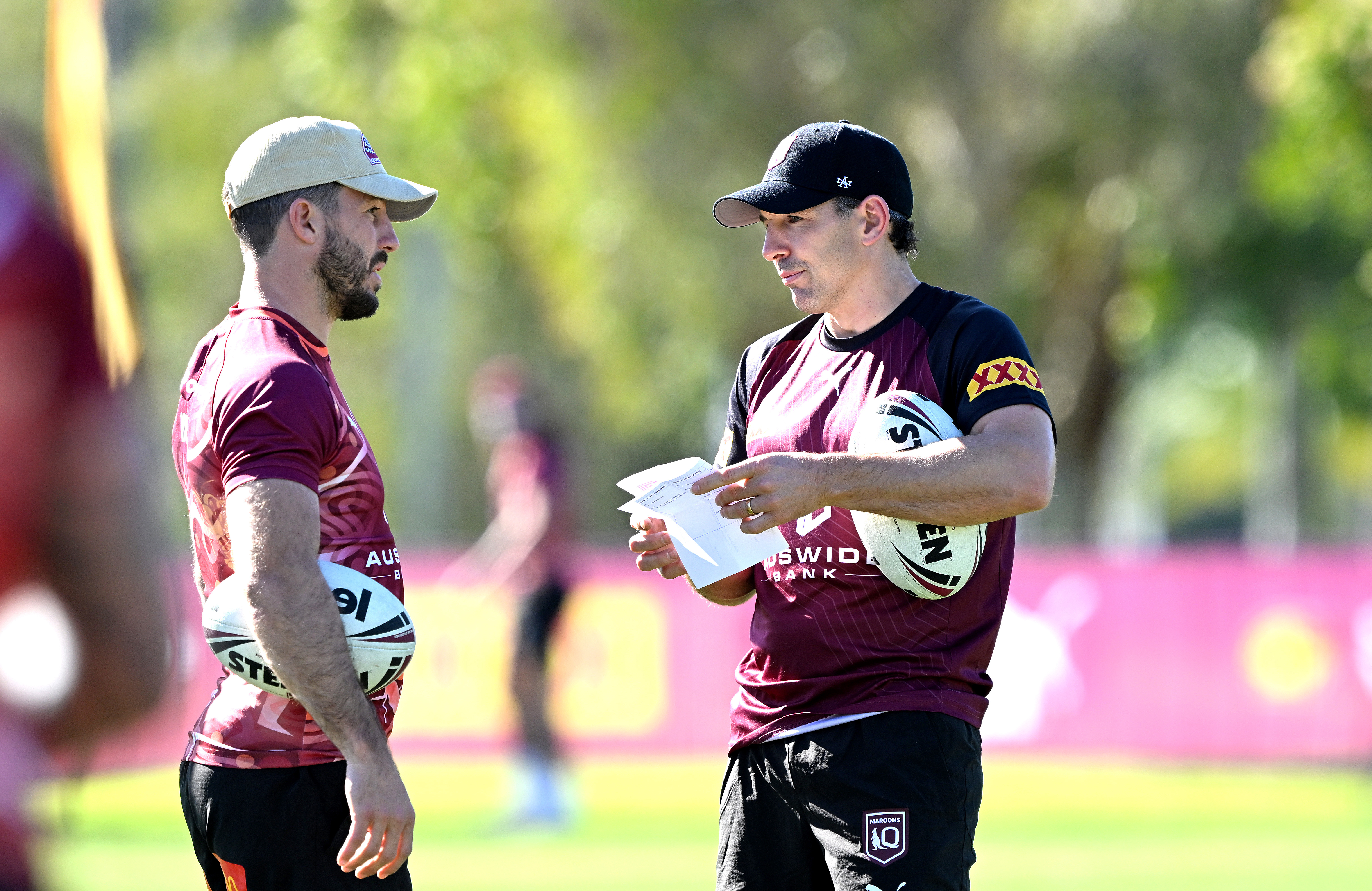 GOLD COAST, AUSTRALIA - JUNE 15: Coach Billy Slater chats with Ben Hunt during a Queensland Maroons State of Origin training session at Sanctuary Cove on June 15, 2023 in Gold Coast, Australia. (Photo by Bradley Kanaris/Getty Images)